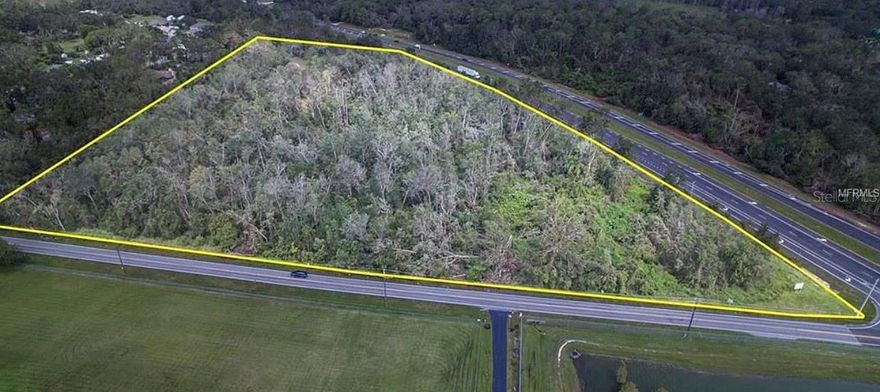 Positioned along the rapidly growing north corridor of Lakeland, this expansive 14-acre parcel offers a rare opportunity to secure a substantial piece of land with direct frontage on US Highway 98 North. With exceptional visibility and steady traffic flow, the property presents an ideal setting for those looking to capitalize on the area’s continued growth and development.  Currently zoned residential, the property provides flexibility for a variety of potential uses, while also offering the possibility of rezoning to commercial—making it especially attractive for investors, developers, or business owners seeking a strategic location with high exposure. The surrounding area continues to see increased demand, with new residential communities and commercial projects shaping the future of North Lakeland.  Infrastructure considerations have already been thoughtfully addressed, with powerlines on site and electric readily available at the property. The parcel will require the installation of a septic system, allowing you to tailor utility improvements to your specific plans. The presence of wetlands on portions of the land creates a natural landscape buffer and added privacy, while also presenting an opportunity—through the Polk County mitigation program—to potentially expand usable acreage in a cost-effective manner.  Whether you envision a private estate with acreage to spare, a residential development, or a future commercial venture, this property offers the scale, location, and versatility to bring your vision to life. Opportunities like this—combining size, highway frontage, and future potential—are becoming increasingly difficult to find in such a prime Lakeland location.
