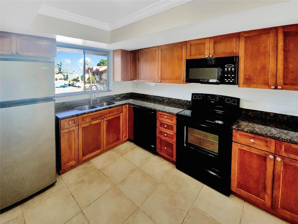 Photo of 705 S Village Drive N #205, St Petersburg, FL 33716 (MLS # O6380803)