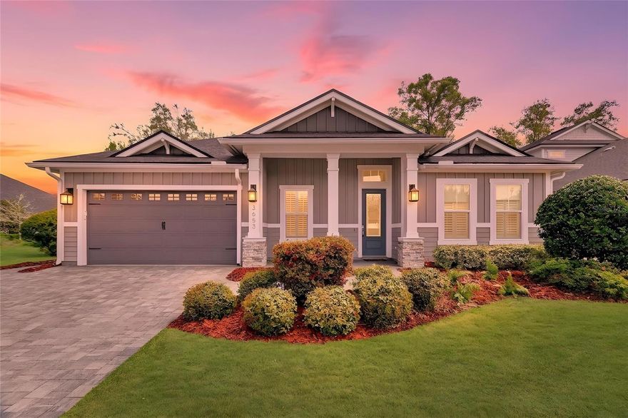 One or more photo(s) has been virtually staged. Experience elevated living in the highly sought-after Oakmont community with this beautifully designed Costa Mesa model offering over 2,650 square feet of thoughtfully crafted living space. This premium lot offers enhanced backyard privacy, creating a peaceful and secluded outdoor setting. 
Featuring a desirable triple-split floor plan with 4 bedrooms, 3 full baths, and a versatile bonus room, this home delivers the perfect balance of privacy, comfort, and functionality.

Designed with both style and everyday living in mind, the open-concept layout creates an effortless flow between spaces, making it ideal for entertaining and relaxed living alike. At the heart of the home, the spacious kitchen showcases a large center island that overlooks the dining and living areas, creating a natural gathering place for family and guests. The living room is truly the showpiece of the home, highlighted by soaring 12-foot ceilings, abundant natural light, and an amazing custom fireplace complemented by picture-perfect built-in shelving and storage, creating a warm yet amazing focal point. Sliding glass doors extend the living space outdoors to a screened lanai, where a brand-new outdoor kitchen creates the perfect setting for year-round entertaining and enjoying Florida living at its finest.

The primary suite serves as a peaceful retreat, offering generous proportions, a spacious walk-in closet, and a well-appointed en-suite bath featuring dual vanities and a large walk-in shower. Additional bedrooms are thoughtfully positioned throughout the home to provide both comfort and privacy for family members and guests.

Throughout the home, plantation shutters add timeless elegance, while the fully fenced backyard enhances both privacy and functionality. The screened lanai creates an inviting outdoor living space, and the addition of a top-of-the-line security system provides peace of mind. Every detail—from the custom fireplace feature wall to the seamless indoor-outdoor flow—has been carefully designed to enhance both everyday living and entertaining.

Residents of Oakmont enjoy access to resort-style amenities including a clubhouse, pool, state-of-the-art fitness center, tennis courts, basketball court, playground, and scenic walking trails. Ideally located just minutes from UF, Shands Hospital, shopping, dining, and I-75, this home offers the perfect blend of luxury, lifestyle, and convenience in one of Gainesville’s premier communities.

Call today to schedule your private VIP tour and experience the Oakmont lifestyle for yourself