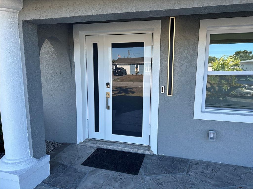 Photo of 717 Crestview Circle NW, Port Charlotte, FL 33948 (MLS # C7519499)