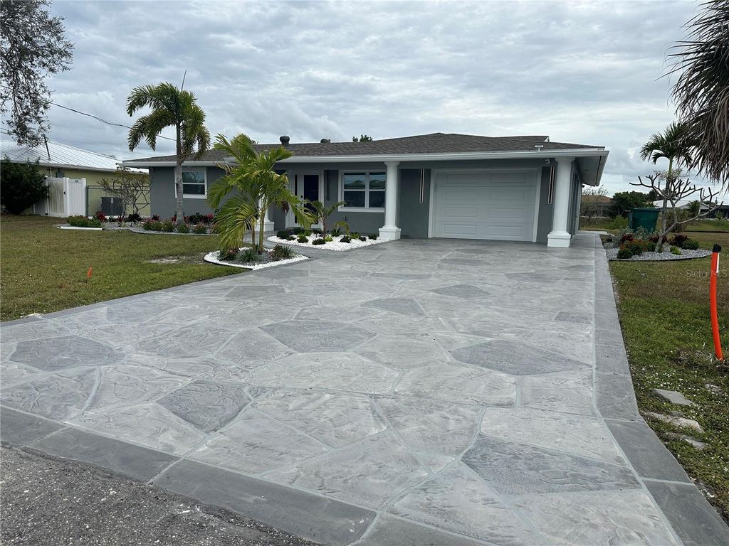 Photo of 717 Crestview Circle NW, Port Charlotte, FL 33948 (MLS # C7519499)