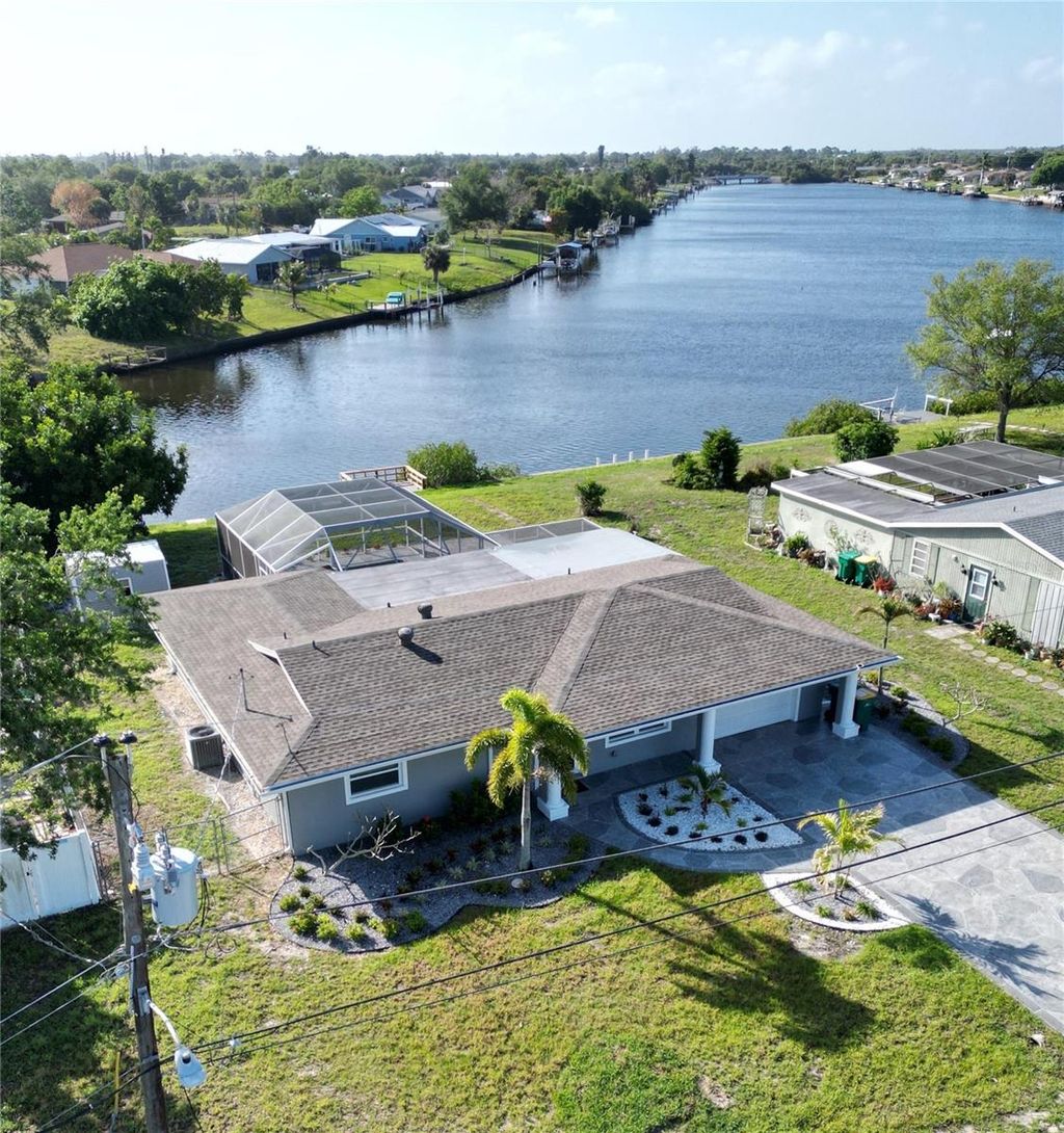 Photo of 717 Crestview Circle NW, Port Charlotte, FL 33948 (MLS # C7519499)