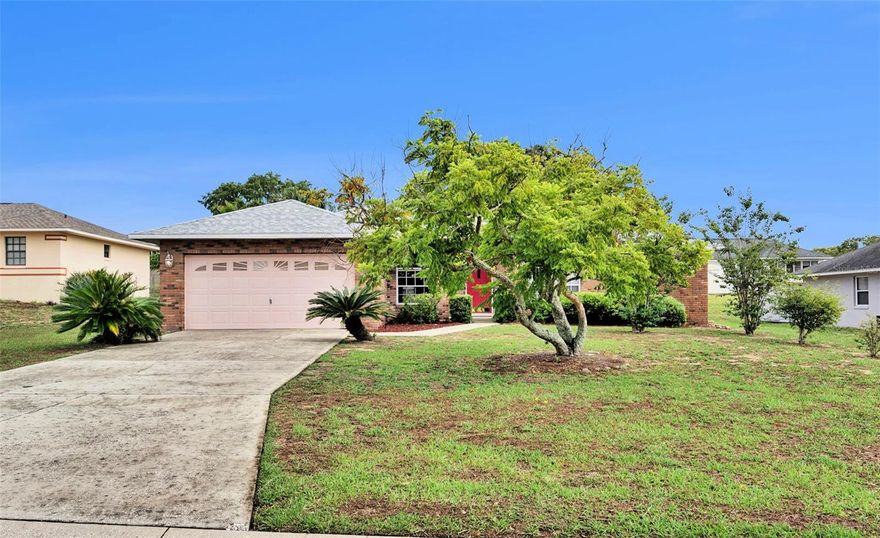 Welcome to this well-kept 3-bedroom, 2-bath home with a den/office, ideally situated in the desirable North Pointe community. Offering a thoughtful layout and numerous upgrades, this home blends comfort, functionality, and style.

Upon arrival, you’ll be greeted by a charming front porch and an attractive brick stone façade. Inside, the spacious living room features beautiful tigerwood flooring, vaulted ceilings, and upgraded ceiling fan, creating a warm and inviting atmosphere.

The eat-in kitchen showcases gray cabinetry that perfectly complements the quartz countertops. Functional upgrades include an updated stainless steel dishwasher and refrigerator, a brushed nickel gooseneck faucet, a double-bowl stainless steel sink, and a closet pantry. A large breakfast bar provides additional seating, while the cozy breakfast nook features French doors leading to the screened lanai, seamlessly blending indoor and outdoor living.

The formal dining room is enhanced with vaulted ceilings and a custom light fixture, creating an inviting setting for family meals and entertaining. Easy-to-maintain solid surface flooring extends throughout the home.

The 11x11 office/den, featuring a large arched window and vaulted ceiling, offers the perfect space for working from home or a quiet retreat.

The primary bedroom suite serves as a peaceful sanctuary with tigerwood flooring, French doors overlooking the backyard, and a walk-in closet. The en-suite bathroom includes dual sinks, a linen closet, a comfort-height toilet, and a walk-in tiled shower.

For year-round enjoyment, the generously sized screened lanai features tile flooring and lovely backyard views, providing the ideal place to relax outdoors.

Additional Features: Laundry room with linen closet, washer, and dryer, Two guest bedrooms and a remodeled guest bathroom, Architectural shingle roof (2025), Water heater (2020), Irrigation system, Exterior carriage lighting and floodlights, Fully fenced backyard with mature landscaping, Additional refrigerator in the garage, Two-car garage with garage door opener.
Conveniently located near shopping, restaurants, schools, biking trails, and within walking distance to Lake Wailes Park, which offers a picnic pavilion, fishing pier, boat ramp, and scenic walking trail along the shores of Lake Wailes, this home provides the perfect blend of comfort and convenience.