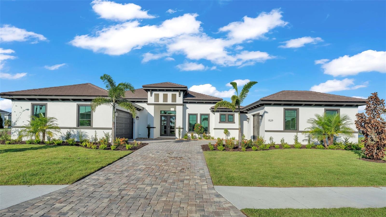 *JUST COMPLETED* *Private Dock to be added!* Stunning New Construction *Custom* Home in The Islands on the Manatee River - gated golf community in Parrish, FL - Your Dream Oasis Awaits!
Welcome to your new home in the heart of beautiful Parrish, Florida! This luxurious 5-bedroom, 4 bathroom 3,277 square foot residence is a custom masterpiece of modern design and comfort. Built with attention to every detail, this home offers an unparalleled living experience.
Key Features include-
Spacious Living: With 5 generously sized bedrooms and 4 bathrooms + a half bathroom elegantly designed, there's plenty of room for family and guests.
Gourmet Kitchen: The state-of-the-art kitchen boasts high-end appliances including full size double ovens, oversized chef's refrigerator and wine cooler, granite countertops, and custom cabinetry. Perfect for the home chef!
Great room//living room: with an open floor plan designed off the kitchen space, enjoy your custom fireplace and relaxing family time while overlooking your pool & patio + waterviews.
Study: Discover the perfect sanctuary for productivity in the dedicated study. This elegant space is thoughtfully designed to inspire focus and creativity, whether you're working from home or pursuing personal projects.
Summer Kitchen: Entertain in style with your outdoor summer kitchen, ideal for barbecues and al fresco dining.
Private Pool & Spa: Dive into your private pool or soak in your spa, surrounded by a beautifully landscaped yard. The perfect spot to relax and enjoy the Florida sunshine, all screened in for maximum comfort.
3-Car Garage bays: Ample space for your vehicles, toys, and storage needs!
Waterview: Enjoy serene water views from your backyard, adding a touch of tranquility to your daily life. This lot is also zoned for a private dock - hop aboard your boat right from your backyard & navigate directly to the Gulf!
Modern Amenities inside & out: The home features the latest in modern conveniences, including smart home technology, energy-efficient appliances, and more. Community amenities include golf, clubhouse, fitness center, community boat ramp, community pool and tennis courts.
Prime Location: Situated in the desirable Parrish community, you'll have easy access to top-rated schools, shopping, dining, and recreational opportunities and just minutes from Lakewood Ranch!
Don't Miss Out! This brand-new stunning *custom* home is a rare find and won't be on the market for long. Schedule your private tour today and experience the best of Florida living!
For more specific information regarding home interior selections & design- including designer lighting, decorative stone shower tiling, and wood look flooring tile, or to arrange a private viewing, please contact the listing agent.