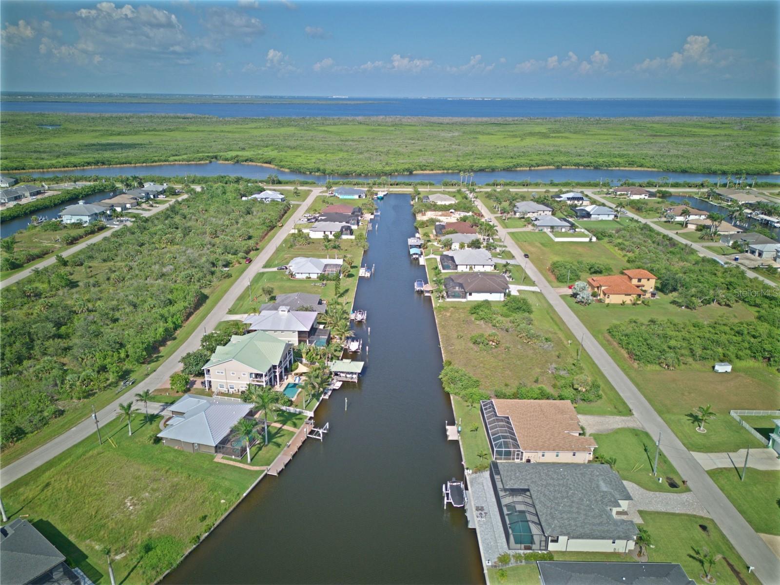 WATERFRONT SAILBOAT LOT – DIRECT GULF ACCESS! Location! Location! Location! Here’s your chance to own a prime piece of waterfront paradise in beautiful South Gulf Cove. This vacant lot features sailboat access with no bridges, giving you quick and easy boating access to Charlotte Harbor and the Gulf of Mexico—a true boater’s dream! Whether you’re into fishing, cruising, or just soaking in the sea breeze, this spot puts you right where you want to be. The lot includes an 80-foot concrete seawall, already in place and ready for your custom dock or future home. Picture yourself launching your boat just steps from your back door, with the open water only minutes away. The canal is wide and deep, perfect for larger vessels and smooth sailing all year long. Located near Boca Grande, this area is known for its serene waterways, natural beauty, and world-class angling. Build now or hold as a smart investment—opportunities like this don’t last long.