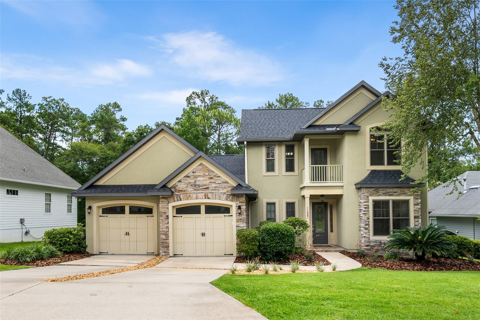 Welcome to this beautifully 4-bedroom, 3.5-bath home built in 2008 located on a premium 0.4 acre lot backing up to peaceful woods—no rear neighbors! The home offers a flexible layout with 4 bedrooms, 3.5 bathrooms and a spacious layout with 3,057 sq.ft. This home has two versatile rooms downstairs, each with matching French doors allowing privacy if needed. Perfect for working from home, a music studio, formal dining room or playroom. The master suite is also downstairs with 3 bedrooms and 2 baths upstairs. Key Features & Updates:*2025: -NEW ROOF May 2025, -All new GE Kitchen Appliances -New ceramic tile in laundry room -New interior paint -New carpet in master and master closets*2023: Premium hybrid heat pump water heater*2019: New upstairs AC unit*Kitchen: Beautiful wood cabinetry with granite countertops*Flooring: Wood floors throughout downstairs and upstairs—carpet only in the master*Master Suite: His and hers closets lead into a spacious en-suite bathroom with separate shower and jetted tub*Lot: Professionally landscaped and backs up to wooded area for added privacy*Zoned for Hidden Oak Elementary and Fort Clarke Middle School and Buchholz High School. One of the most desirable school zones in Gainesville!