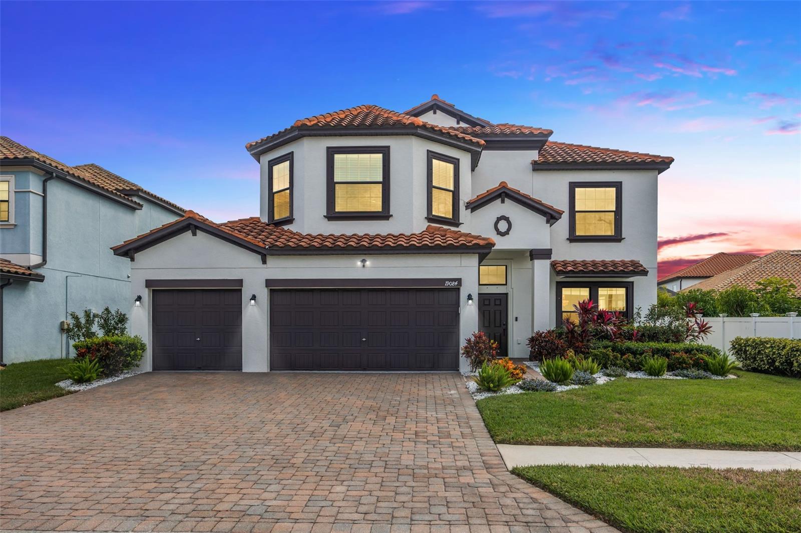 Welcome to 19084 Shalott Court, a stunning 6-bedroom, 3-bath, 3-car garage pool home located in The Retreat of Concord Station, situated on a premium conservation and pond homesite. Built in 2015, this beautifully maintained home offers a resort-style backyard with a heated pool and spa, designer shell lock pavers, and fully fenced in yard ideal for year-round Florida living. Curb appeal is enhanced by a tile roof, paver driveway, and landscaping and irrigation system. Inside, you'll find engineered wood flooring, upgraded light fixtures/ chandeliers, ceiling fans, and an in-wall pest control system. The home features two brand-new HVAC systems (2025) for energy-efficient comfort. The first floor includes a formal living and dining room with a designer wood accent wall, and a spacious kitchen featuring espresso solid wood cabinetry, granite countertops, stainless steel appliances, crown molding, walk-in pantry, breakfast bar, and eat-in space that opens to the family room, all with tranquil views of the pool and pond. A guest bedroom and full bath on the main level offer flexibility for guests or multi-generational living. Upstairs, the oversized primary suite includes dual walk-in closets and a luxurious ensuite bath with granite dual vanities, soaking tub, walk-in shower, and private water closet. Generously sized secondary bedrooms offer ample space for family or home offices. The fenced backyard is perfect for entertaining or relaxing in privacy. Located in the low-HOA community of Concord Station, residents enjoy access to top-rated schools and resort-style amenities including a clubhouse, fitness center, community pool, playgrounds, tennis and basketball courts, and bike trails. With quick access to the Suncoast Parkway, you’re just minutes from Tampa International Airport, Downtown Tampa, Westshore Business District, premier shopping, dining, and Tampa Bay’s most beautiful beaches. This move-in-ready home offers the perfect blend of luxury, location, and lifestyle—don’t miss it!