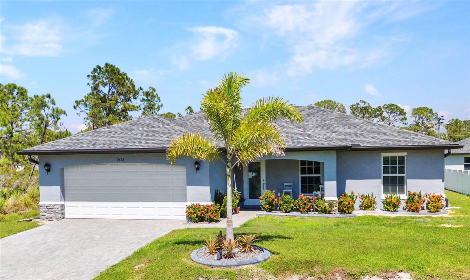 Welcome to this beautifully designed open-concept home, newly completed in 2023 and meticulously maintained. Offering a split bedroom floor plan with 3 bedrooms, 2 full bathrooms, PLUS a versatile front bonus room—currently used as a home office, but ideal as a playroom, workout room, craft space, or even a 4th bedroom—this home is designed to adapt to your lifestyle. The kitchen features natural stone counters with a sit up breakfast bar island that is open to the dining and living room enhanced by the high cathedral ceiling for a spacious airy feel. Enjoy numerous high-end upgrades including a pavered driveway and walkway, lush professional landscaping with curbing and a programmable rain sensor irrigation system, IMPACT RESISTANT WINDOWS, updated light fixtures and ceiling fans, whole-house Reverse Osmosis water system, elegant plantation shutters and remote control shades, and sleek stainless steel appliances. Easy to clean tile flooring throughout the entire home so NO CARPETING. Step outside to the enclosed back lanai—perfect for relaxing or entertaining—overlooking a generously sized backyard with plenty of room to add a pool and create your dream outdoor oasis. A fantastic location with quick easy access onto I-75 with Warm Mineral Springs, the beautiful Gulf beaches and the upcoming Wellen Park / Cool Today Atlanta Braves Spring Training facility and just a couple miles to the approved planned state-of-the-art Sarasota Memorial Hospital of North Port on Sumter near I/75. So many great shopping and dining options in the area. If you are looking for a low maintenance, quiet home base location with lots of activity and things to do that are nearby, this is it! Live here full time or do seasonal rental for an income producing option. This home combines style, function, and peace of mind in every detail. Don't miss your chance to make it yours!