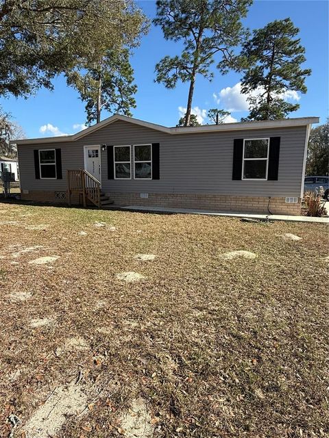 Photo of 8325 N Fairgrove Terrace, Dunnellon, FL 34433 (MLS # V4947617)