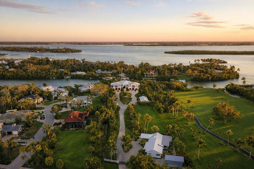 Welcome to a once-in-a-generation private waterfront family compound on the coveted north end of Longboat Key—an extraordinary 2.4 acre, fully gated coastal estate that blends architectural mastery, resort-level amenities, and rare development potential. Encompassing four buildable parcels (500, 510, 520 Nomas Way and 6680 Gulf of Mexico Drive), this legacy property offers unparalleled privacy, flexibility, and long-term value. From the moment you arrive, illuminated by classic Bevelo gas lanterns, the estate unfolds with intention and elegance. The custom-designed main residence is complemented by a separate 3-bedroom, 2-bath, 1,850-sq-ft guest home with a detached garage—perfect for extended family, guests, or staff accommodations. Every detail reflects thoughtful craftsmanship, from the 900-bottle red cedar wine cellar to the oversized custom wood-burning fireplace with gas option. Designed for both grand entertaining and everyday indulgence, the chef’s kitchen features natural gas cooking with Wolf and Sub-Zero appliances, while state-of-the-art home automation and whole-home sound elevate daily living. Step outside to a true private resort: a 15,000-gallon free-form pool with a 1,000-gallon spa, heating and chilling via reverse heat pump and natural gas, and an expansive custom tiki pavilion built for unforgettable gatherings. For boating enthusiasts, this estate is unmatched—165 feet of frontage on Bishops Bayou, two docks, three boat lifts, and deep-water, direct Intracoastal access. Across Gulf of Mexico Drive, deeded private beach access makes turquoise waters and nightly sunsets a daily ritual. Car collectors and hobbyists will appreciate six garages, including an automotive lift, plus a 50’ x 24’ covered pole barn for additional storage. Peace of mind is absolute with a 24-camera security system, safe room, elevator, and a 60kW natural gas generator powering the entire estate during any weather event. Fully fenced and gated, this property offers complete privacy without compromise. This is more than a home—it is a coastal masterpiece, a designer’s dream that exudes sophistication, balance, and harmony. An irreplaceable opportunity to own one of Longboat Key’s most remarkable waterfront estates, where luxury, security, and lifestyle converge in perfect alignment.