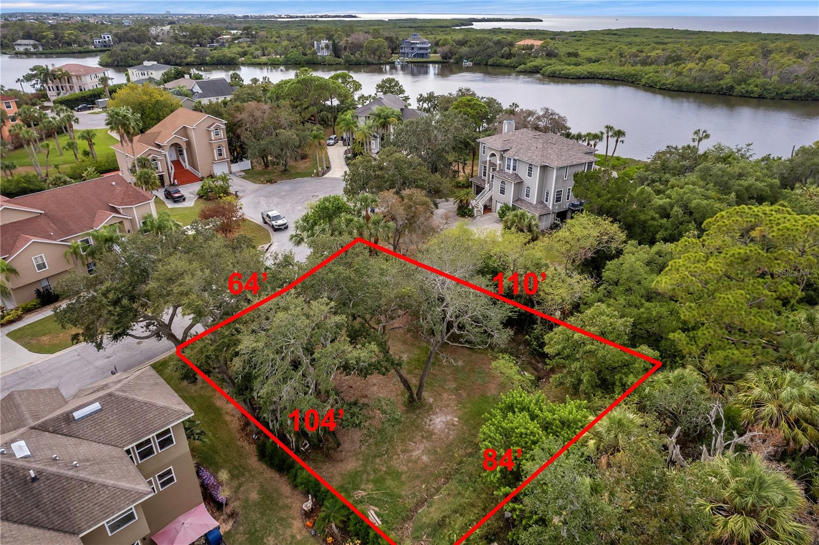 BEAUTIFUL OYSTER BAYOU IS THE PERFECT PLACE TO BUILD YOUR CUSTOM DESIGNED DREAM HOME! WATERFRONT AND GATED, Surrounded by stunning custom built homes. No rear neighbors for added privacy in this unique small community. PRIVATE COMMUNITY BOAT RAMP! Bring your kayak, jet ski, or other low draft watercraft and enjoy a day on the water fishing or head out to the Gulf of Mexico through the Wigwam Creek to Oyster Bayou then to the open waters. Find you perfect fishing hole or just plan a relaxing day! Whisky Joes Bar and Grill is only 1 Mile away, take your golf cart for a short ride to DOWNTOWN NEW PORT RICHEY for more shops, restaurants or enjoy one of the many festival events. Robert K Rees Beach is newly renovated and a great place to soak in the sun. Low Annual HOA only $450 yr., no time limit to build, no short term rentals allowed. TRUELY A PLACE YOU WILL BE PROUD TO CALL HOME!