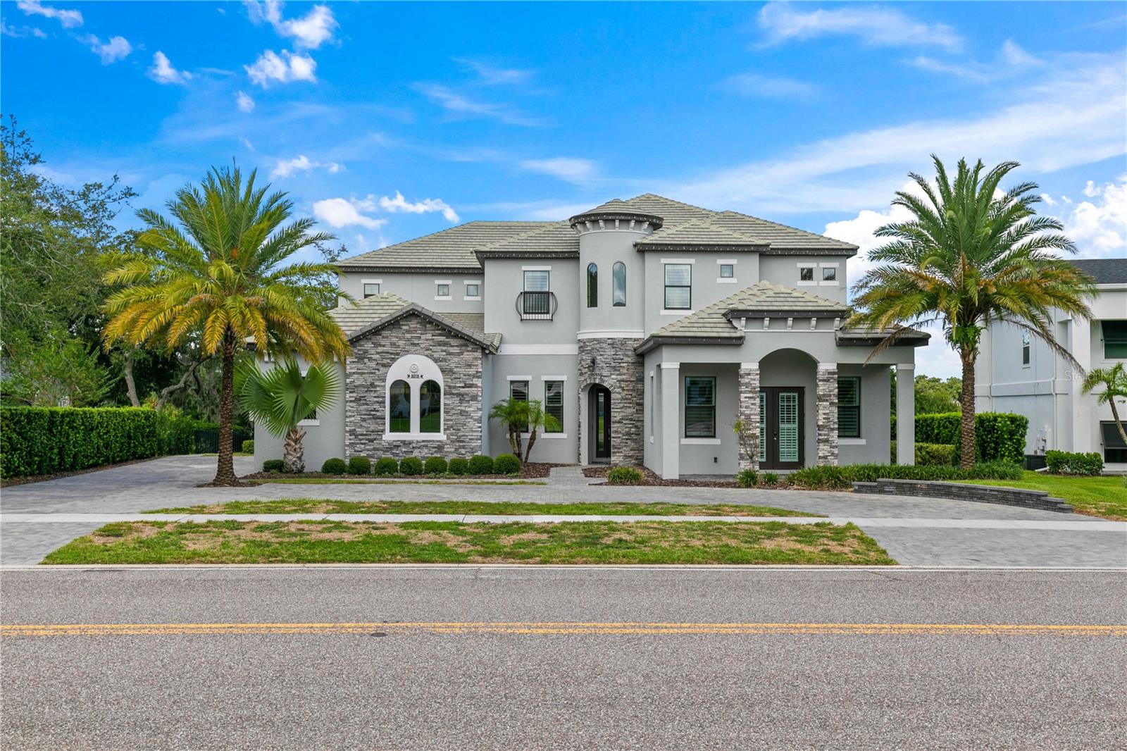 Motivated Seller – Bring Your Offers!
Experience luxury living at its finest in this exceptional Bay Hill residence, perfectly positioned on the 3rd tee of the world-renowned Arnold Palmer Golf Course. With breathtaking views of the lake and championship greens, this 6-bedroom, 6 full and 2 half-bath home spans over 5,800 sq. ft. of thoughtfully designed living space.
Step inside to soaring 12-ft ceilings on the main level and 10-ft ceilings upstairs, creating an open and elegant flow throughout. The chef’s kitchen, complete with a spacious island, custom cabinetry, and premium appliances, seamlessly connects to the dining nook and family room—each offering stunning views of the pool, golf course, and lake. A formal dining room with butler’s pantry sets the stage for entertaining in style.
The main-floor primary suite is a private retreat with two oversized walk-in closets and a spa-like bath. A private study with its own entrance and a poolside guest suite make the layout ideal for working from home or multi-generational living. Upstairs, four additional bedrooms—two with en-suite baths and walk-in closets—are complemented by a full movie theater with stadium seating, a large bonus room, and convenient upstairs laundry.
Outdoor living shines with a spacious patio and sparkling pool, creating the perfect backdrop for gatherings or quiet relaxation against the backdrop of the greens.
This is more than a home—it’s the ultimate Bay Hill lifestyle. And with a highly motivated seller, now is the perfect time to make it yours.
Schedule your private tour today and discover the ultimate Bay Hill lifestyle!