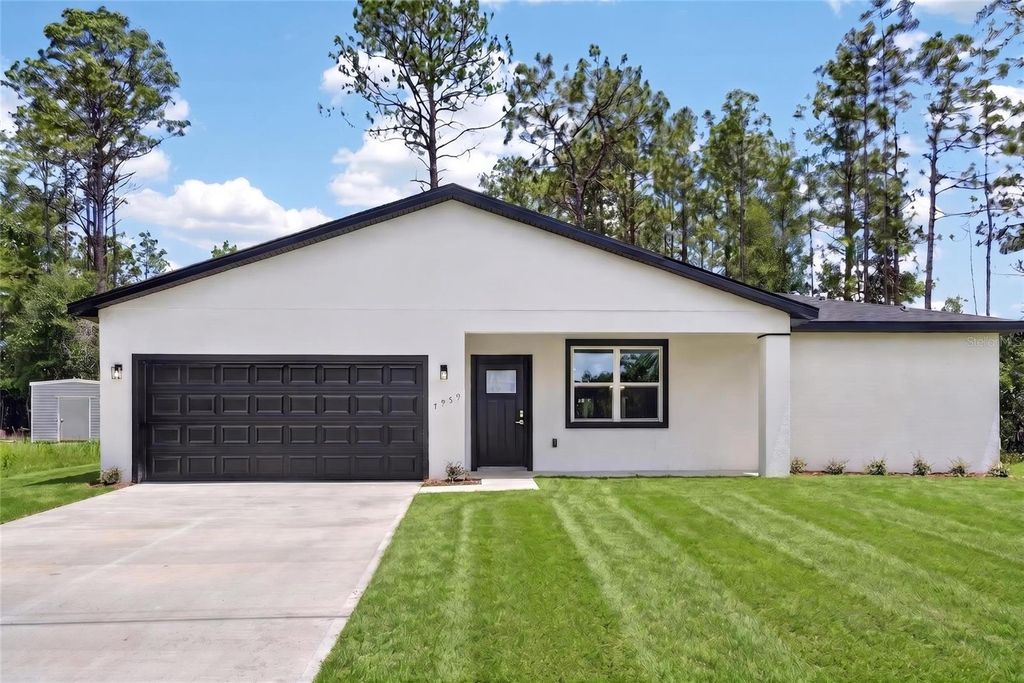 Photo of 7959 N Sarazen Drive, Citrus Springs, FL 34434 (MLS # O6419706)