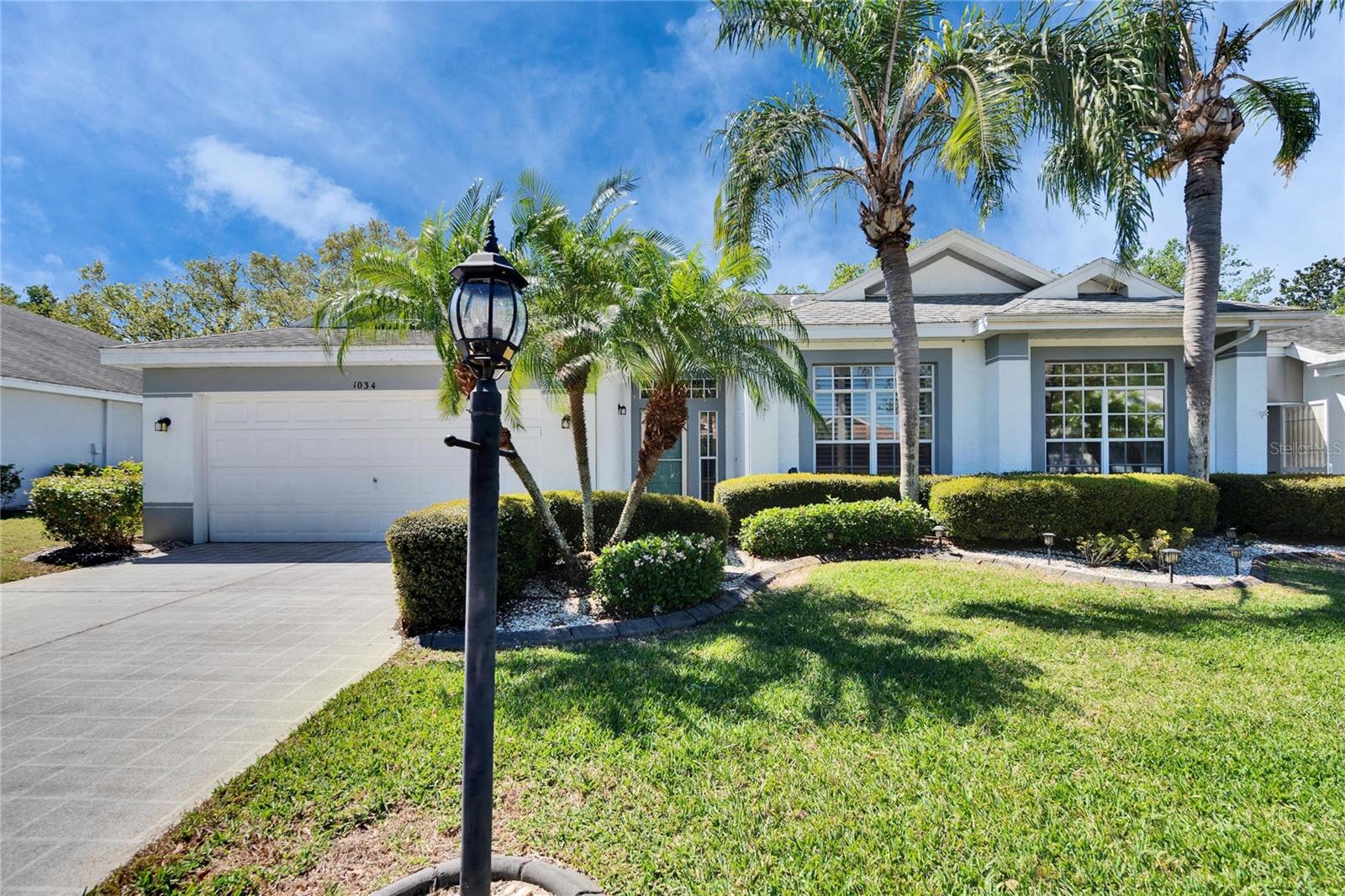 Welcome home to one if the top rated retirement communities in the country, where everyone and their golf carts are welcome….. Don't miss out on your chance to live in the GATED community of Kings Point. This 2 Bedroom, 2 Bathroom floor plan is highly sought after and features high ceilings, an inviting eat-in area in the kitchen and flex space which can be used as a dining room, office or third bedroom. The kitchen is spacious, with light wood tone cabinetry, a center island with extra storage and food prep space, and a bar height counter top space open to the living area for casual seating. The in kitchen casual dining area is tucked into the bay window and makes for a great space for morning coffee. The split-floor plan ensures privacy and boasts a spacious primary bedroom, with two walk-in closets, and an en-suite bathroom featuring dual sinks, a garden tub, and a walk-in shower. The second bedroom is spacious with convenient access to the second full bathroom. The garage is has a second refrigerator and shelving/storage units, a utility sink and space for 2 cars or one car and a golf cart. Kings Point's is a maintenance-free, resort style community with virtually everything included such as gated security with 24-hour guard, premium cable, internet, exterior property maintenance, grounds maintenance, pest control, sewer, trash, and water. That's not all, there are two beautiful clubhouses, an 850-seat theater, 6 heated pools, 2 hot tubs, an elegant spa, tennis courts, pickle ball, state-of-the-art fitness centers, billiards, bingo and much more. There are scores clubs with all sorts of activities that will keep you busy year-round and this community also has its own free transportation system. Landlord pays basic cable, internet, water/sewer, amenities fees for 2 tenants, pest control, lawn maintenance, while the tenant pays for electric, telephone, and additional TV channels. No smoking, no pets. Apply at: https://apply.link/UEgvqUA