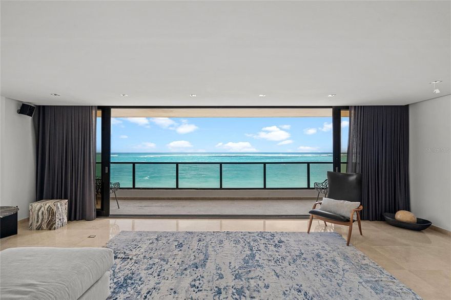 Welcome to 1 Cervantes! Introducing a rare full-floor beachfront residence in the heart of Condado, with direct ocean views and a highly functional layout in one of the most sought-after locations in the area.

The elevator opens directly into the apartment, leading to an expansive open-concept design spanning over 3,022 square feet. 1 Cervantes is one of the very few buildings in which the primary bedroom and the living, dining, and family rooms are all positioned along the beachfront side of the home. Floor-to-ceiling windows frame uninterrupted ocean vistas and fill the interior with natural light, creating a seamless connection between indoor living and the shoreline. 

The beachfront primary suite is thoughtfully separated from the secondary bedrooms, offering a comfortable retreat with ocean views and an en-suite bath. Two additional main bedrooms, a guest bedroom, two additional full bathrooms, and one half bathroom provide flexibility for guests, home office, or multi-generational living. The floor plan is designed to maximize usable space and circulation, with clearly defined living and sleeping areas.

Marble floors run throughout, contributing to a clean, cohesive aesthetic and easy maintenance in a coastal environment. The residence includes three dedicated parking spaces, a valuable convenience in Condado. Building is equipped with 24-hour security, a full power generator, and water cistern. The beach is your main amenity and a variety of gyms are walking distance.

Located in what is widely regarded as one of the best positions in Condado, this property places you directly on the beach and within short distance of schools, restaurants, shopping, and entertainment. The combination of a full-floor layout, beachfront exposure, and central Condado location makes this home well suited for both full-time living and use as a serene retreat.

This four-bedroom, three-and-a-half-bath condominium is offered for sale and presents a compelling opportunity for buyers seeking direct beachfront living, comfortable interior space, and a prime Condado address.