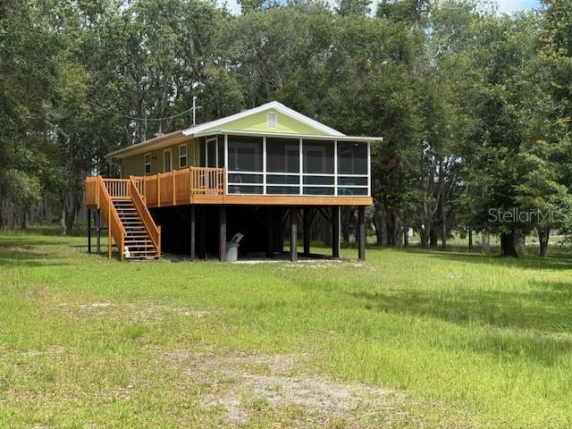 RECENTLY UPDATED!!! Discover Serenity and escape to your own slice of paradise nestled between a nature conservancy and federal forest land. This perfectly secluded 10 acre stilt home offers not only breathtaking views but also the peace and quiet you've been longing for. This home blends modern comfort with natural beauty seamlessly. Imagine waking up to the sounds of nature and enjoying your morning coffee on the custom seer stand, perfect for hunting enthusiasts and wildlife admirers alike. Located at the back of the community, privacy is guaranteed, allowing you to unwind and reconnect with what matters most. Don't miss out on this unique opportunity to own a piece of Florida's tranquil charm. Contact us today to schedule your private showing and start envisioning your new life at 1885 Pfundstein Rd., where every day feels like a getaway.