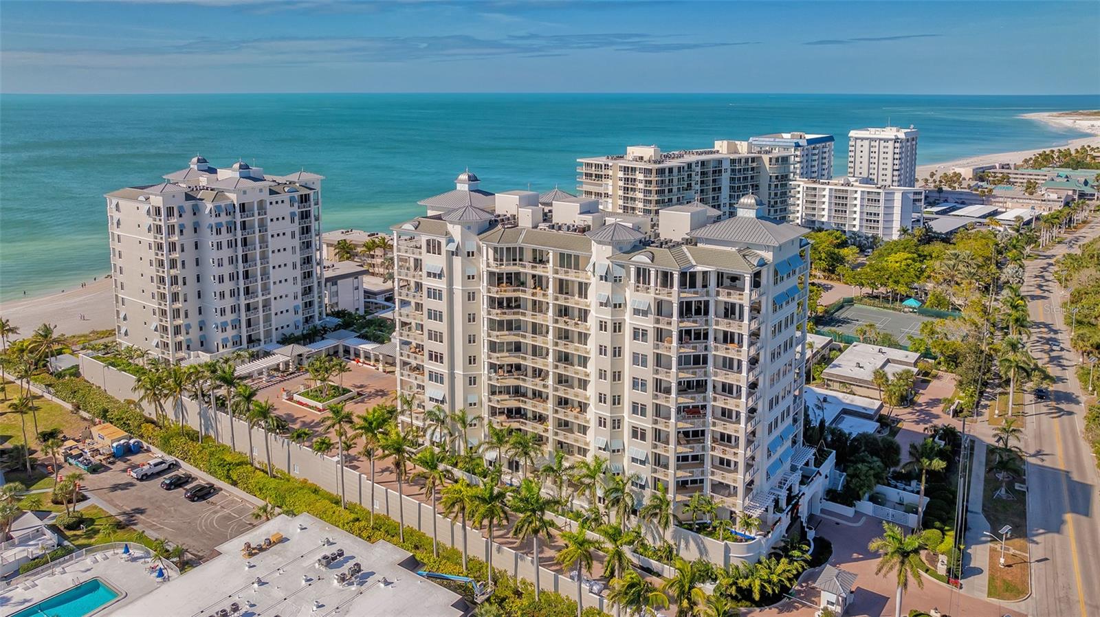 Under contract-accepting backup offers. Indulge in the epitome of coastal elegance with this extraordinary residence at Orchid Beach Club, offering breathtaking panoramic views that stretch from the Gulf of Mexico to Sarasota Bay, capturing the entire southern tip of Lido Key. Boasting nearly 3,000 square feet of meticulously designed living space, this residence features three en-suite bedrooms, a spacious great room, a charming breakfast room overlooking the azure waters, and an eat-in chef's kitchen complete with a gas cooktop. Three generously sized balconies enhance the allure of this home, providing the perfect vantage point to soak in the stunning vistas. Elegance abounds with crown molding, tile and wood flooring, and impact-rated windows and doors that seamlessly blend beauty with functionality. Enjoy the convenience of two designated parking spaces and elevate your outdoor gatherings with a stainless gas grill on the main balcony. Orchid Beach Club stands as a pinnacle of Gulf-front living, offering a suite of unparalleled amenities. Residents revel in a beachside heated pool and spa, complete with cabanas, a dedicated dog run for furry companions, lush courtyards, and a guarded gate entrance for utmost security. The club level, adorned in world-class island sophistication, features a large social room with a bar, an exquisite dining/conference room equipped with a full catering kitchen, a game room, a library, a spacious fitness center, and rentable guest suites. Impeccable concierge service and on-site management ensure a lifestyle of utmost convenience and luxury. Nestled on the serene southern end of Lido Key, Orchid Beach Club provides an oasis of privacy while still being just moments away from the vibrant culinary, shopping, and entertainment scenes of St. Armands Circle and downtown Sarasota. This is not just a residence; it's a gateway to a life of coastal splendor and sophistication. Seize this opportunity to make Orchid Beach Club Barbados your home and experience the pinnacle of Gulf Coast living.
