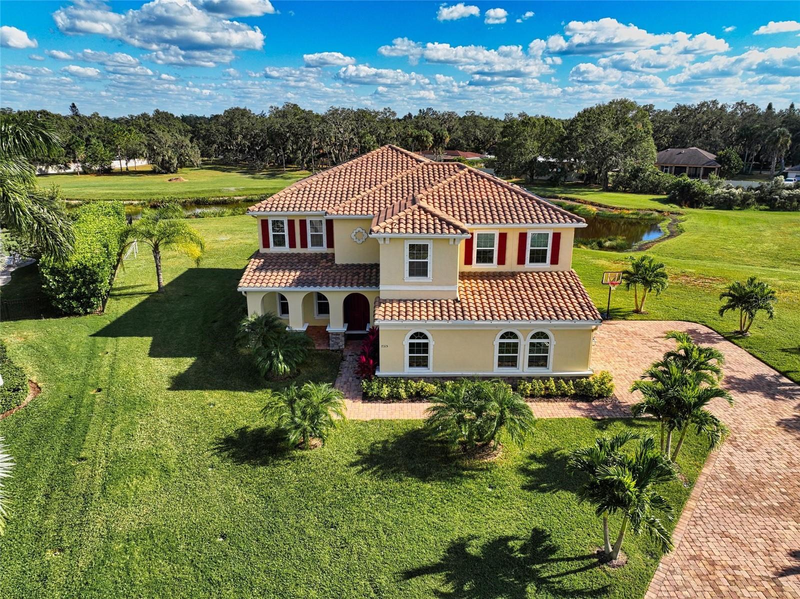 One-of-a-Kind Luxury Family Retreat – Estate Lot, Saltwater Pool, and Sunshine All Day
This exceptional custom-built home is nestled at the end of a quiet cul-de-sac in Vilano, one of Sarasota’s most desirable gated communities east of I-75. Set on a premium estate-sized 3.76-acre lot on a former golf course, it offers unmatched privacy, expansive indoor and outdoor living spaces, and the largest saltwater, solar-heated pool (44' x 18') in the neighborhood—perfectly positioned for sun all day. The pool area features a paver patio and covered lanai, ideal for outdoor entertaining and relaxation.
Most of the acreage is maintained by the HOA, giving you the feel of a secluded estate without the upkeep. Inside, you’ll find great natural light quality, a gourmet kitchen with granite countertops, desk area, pantry, and butler’s pantry, flowing into a spacious open-concept great room and formal dining area. A private office, guest suite with en suite bath, powder room, laundry room, and ample storage complete the main floor.
Upstairs includes four additional bedrooms—three with en suite baths and walk-in closets—plus a generous family/media room perfect for entertaining or retreating in comfort. Crown molding, thoughtful finishes, and an oversized 3-car garage enhance the home’s luxury and function.
Located near top-rated schools, medical centers, and premier shopping and dining—with downtown Sarasota and world-famous beaches just 20 minutes away—this property offers the rare combination of space, serenity, and convenience in a sought-after Florida location.