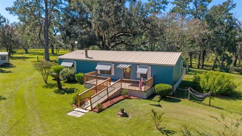 Photo of 15320 NW 112 Avenue, Reddick, FL 32686 (MLS # OM711520) Photo of 15320 NW 112 Avenue, Reddick, FL 32686 (MLS # OM711520)