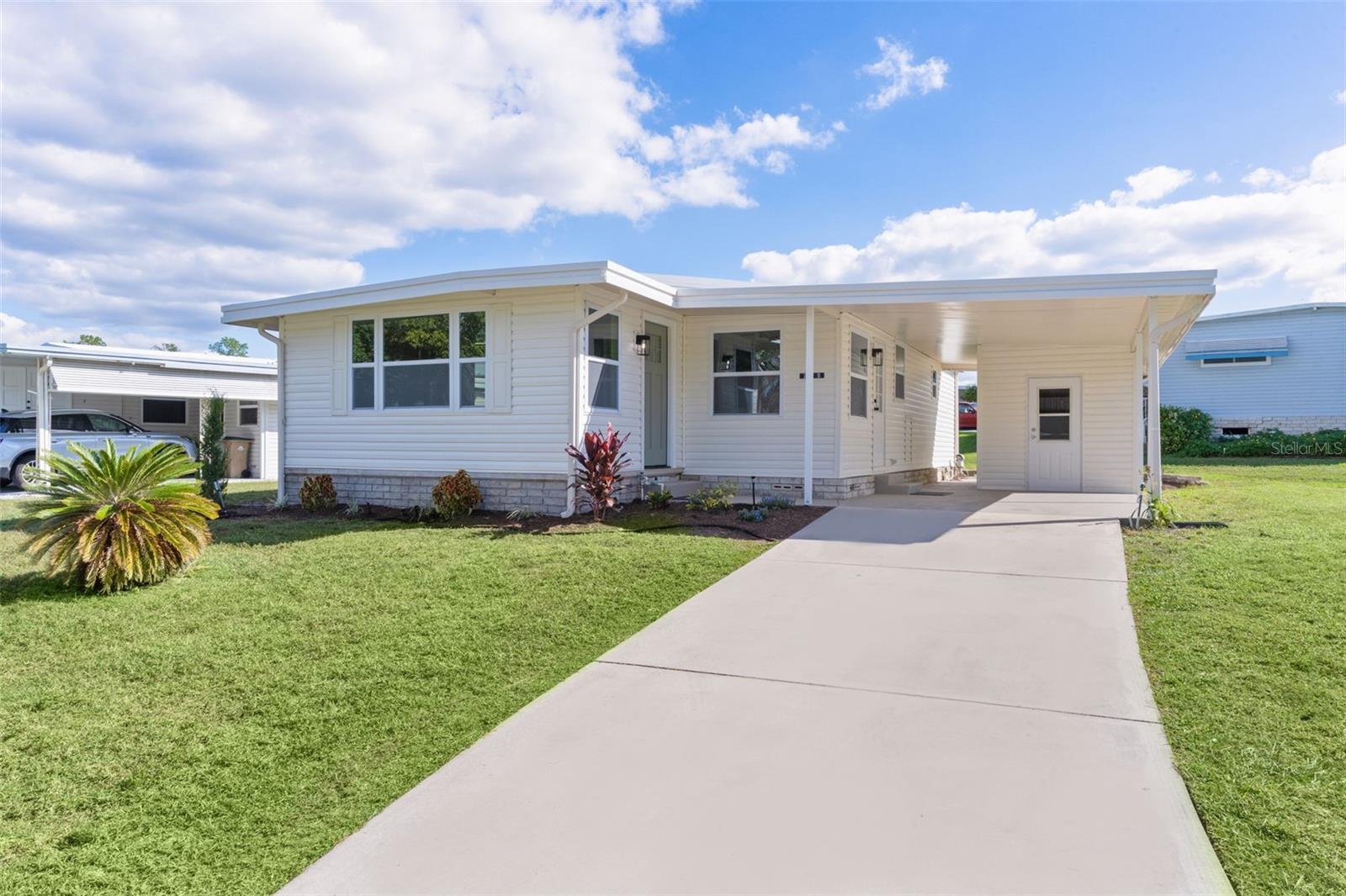 One or more photo(s) has been virtually staged. Beautifully Renovated Home on the Chain of Lakes
Step into comfort, style, and peace of mind with this fully renovated home located in the desirable 55+ lakefront community of Hawthorne at Leesburg. Thoughtfully redesigned with today’s buyer in mind, this elegant residence offers modern convenience, timeless finishes, and a tranquil setting.
From the moment you arrive, you’ll appreciate the all-new exterior siding, double-pane windows, fresh paint, textured and painted driveway, and updated landscaping that enhance the home’s inviting curb appeal. Inside, the open floor plan allows for natural flow and effortless entertaining, complemented by warm wood tones and carefully chosen design elements that create a welcoming and balanced atmosphere.
This spacious two-bedroom, two-bath home also includes a versatile bonus room/den—ideal for a home office, formal dining area, or game room. The living area features a beautiful accent wall, recessed lighting, and an open, comfortable space perfect for relaxing or hosting guests.
The custom-designed kitchen is a true showpiece, showcasing 36-inch shaker-style cabinetry, quartz countertops, a workstation island with seating, tile backsplash, recessed lighting, pantry, and all-new stainless-steel appliances. Every detail has been thoughtfully upgraded throughout the home, including luxury vinyl plank flooring, tile, new interior doors, vents, ceiling fans, lighting, and plumbing fixtures.
The primary suite offers a spa-like retreat with a beautifully designed tile shower featuring glass doors and a modern sliding barn door for style and space efficiency. Both bathrooms have been completely updated with new vanities, toilets, custom linen storage, and expanded shower and tub designs.
Additional updates include a new hot water heater, a new whole-house A/C system with additional venting for the bonus room, a freshly sealed roof, and an updated irrigation system with a French drain for improved drainage. Every inch of this home reflects care, quality, and attention to detail, making this renovation truly complete and move-in ready.
Hawthorne at Leesburg is a vibrant 55+ community that offers comfort, convenience, and an active lifestyle. For just $346 a month, residents enjoy a maintenance-free way of living that includes water, sewer, lawn care, emergency services, and access to an array of resort-style amenities.
The expansive clubhouse serves as the social heart of the neighborhood, offering over 100 organized activities along with a fitness center, library, fine arts studio, card rooms, billiards, and more—all coordinated by a dedicated activities director. Outdoor enthusiasts will love the private marina with over 120 boat slips providing direct access to the beautiful Harris Chain of Lakes.
Safety and peace of mind are at the forefront, with 24/7 on-site firefighter and EMT services, emergency vehicles, and in-home emergency response systems. Residents also enjoy scenic walking trails, lake views, and golf cart–friendly streets that make it easy to reach nearby shopping, dining, and medical facilities. With a sparkling pool, welcoming neighbors, and a warm community atmosphere, Hawthorne at Leesburg isn’t just a place to live—it’s a lifestyle.
Schedule your private showing today and experience the perfect blend of comfort, community, and lakefront living.