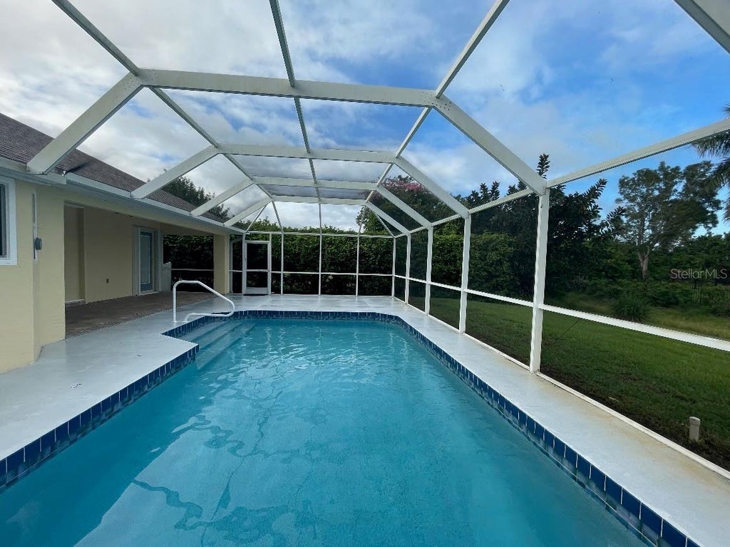 Photo of 813 Boundary Boulevard, Rotonda West, FL 33947 (MLS # C7531527)