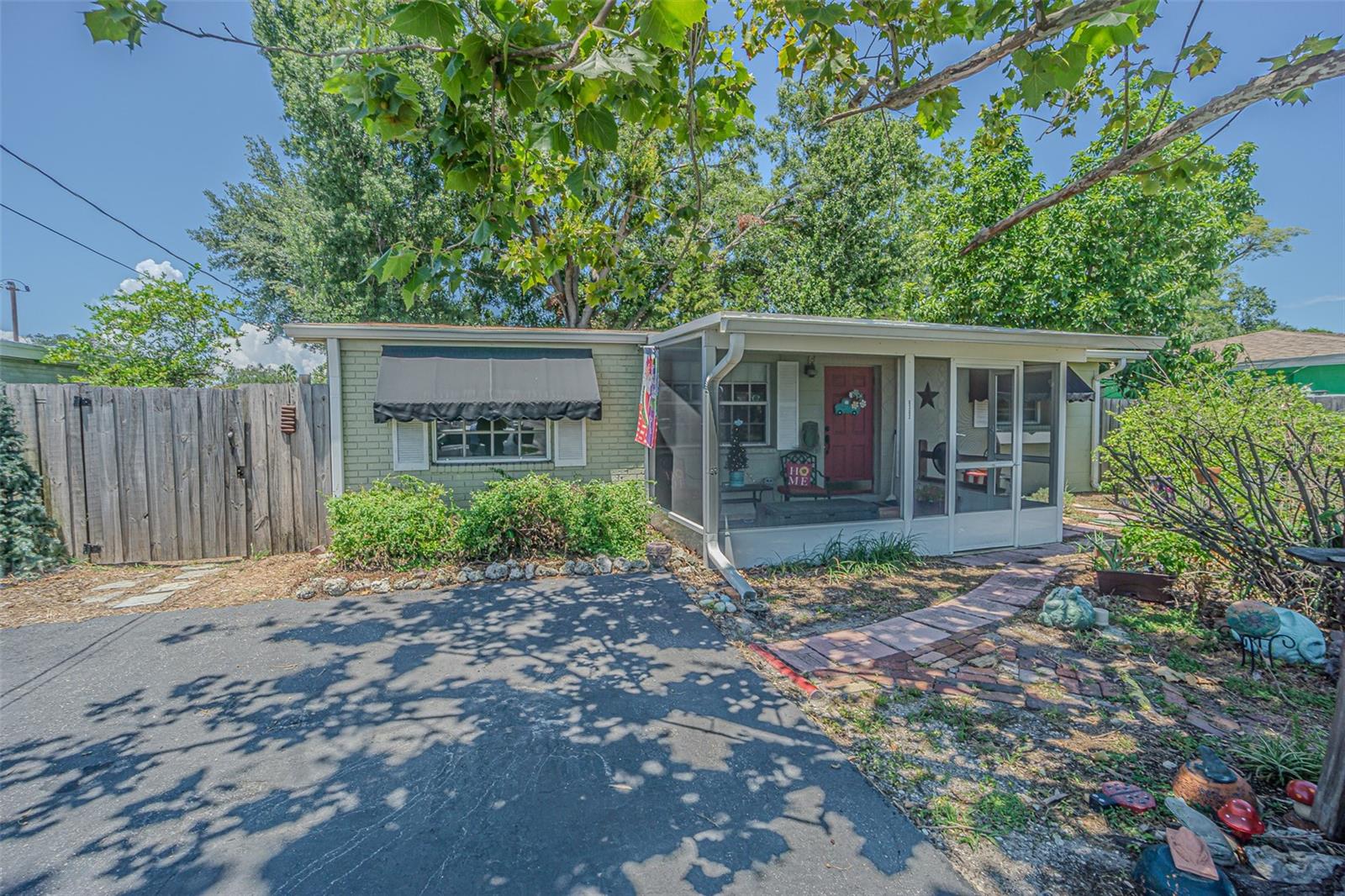 No HOA. Well-Maintained 4-Bedroom Home in Prime Town 'N' Country LocationWelcome to your new home in the heart of Town 'N' Country—just off W. Hillsborough Avenue and the Veterans Expressway, offering unmatched convenience to shopping, dining, schools, and major highways.Proudly owned and lovingly maintained by the same family for over 50 years, this spacious 4-bedroom, 2-bathroom residence features a desirable split-bedroom floor plan with a private in-law suite. Situated on a fenced lot with no rear neighbors, this home offers peace and privacy while still being close to everything.Step through the screened front entry into the open living and dining area, highlighted by durable vinyl flooring. Just off the living space, you’ll find two comfortable guest bedrooms and a full bathroom. A generously sized third bedroom is located off the dining area, while the heart of the home—the kitchen—connects to everything.At the back of the house, the 16' x 13' tiled family room provides a relaxing space with views of the private backyard. Adjacent to this room is the fourth bedroom with carpet flooring—ideal as a full in-law suite or private guest quarters. You'll also appreciate the dedicated indoor laundry room (8' x 5') featuring a tankless water heater—a rare find in this area.Key Updates Include: Roof (Dec 2013), A/C System (Oct 2020), Windows (Mar 2000), Electrical Panel (2014), Tankless Water Heater (Sept 2023)Don't miss this rare opportunity to own a move-in-ready home in one of Tampa's most convenient neighborhoods. Schedule your private showing today!