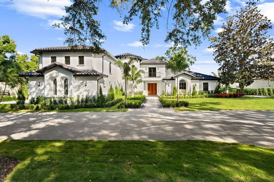 Newly renovated and fully turnkey, this private Isleworth residence offers a rare balance of architectural authority, thoughtful design, and quiet indulgence.
Spanning approximately 8,000 square feet, the home unfolds with intention. Rich walnut cabinetry and wood detailing create warmth and continuity throughout, while the fireplace and wine cellar anchor the living spaces with understated elegance. Every room feels deliberate, refined, and composed.

The kitchen is a statement of both form and performance; finished with Taj Mahal quartzite countertops, a 60-inch Wolf gas cooktop, Dacor refrigerator and freezer, two warming drawers, a steam oven, and a discreet hidden pantry designed for seamless entertaining. Dual dishwashers and two laundry areas support effortless daily living behind the scenes.
Designed for both privacy and flexibility, the home features six bedrooms, a dedicated office, a bonus room with a closet suitable as an additional bedroom, and an elevator for ease across levels. Bathrooms are equally considered, with five full and 2 half baths, all executed with a calm, modern sensibility.
Outdoors, the residence enjoys full privacy and tranquil pond views, complemented by a gas-heated pool and jacuzzi, and summer kitchen; a serene backdrop for both quiet mornings and refined gatherings.
Mechanically, the home has been comprehensively updated with four new A/C units (2025), two tankless water heaters, and recently replaced garage doors and motors, ensuring modern efficiency beneath the elegance.
It is a residence restored with intention, where discretion, craftsmanship, and comfort converge.
Private showings are easily accommodated, including same-day requests.