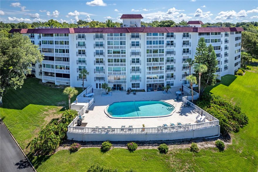 Enjoy refined downtown living in this beautifully renovated 3-bedroom, 3-bath condominium in the desirable Villa Dora community, just two blocks from the heart of Mount Dora. This ground-floor unit offers 1,613 square feet with an open, light-filled layout and two spacious primary suites, both featuring stunning views of Lake Dora. The updated kitchen showcases cherry wood cabinetry, stone countertops, stainless steel appliances, and generous storage, flowing seamlessly into the living and dining areas and out to a large sun porch overlooking the pool and lake—perfect for relaxing or entertaining.

Interior features beautifully updated bathrooms with stone counters and tiled showers, and the convenience of an in-unit washer and dryer. The third bedroom offers flexibility for guests, office space, or additional living needs. Assigned covered parking and ample storage add to the home’s functionality.

Villa Dora residents enjoy a well-maintained community with a heated pool overlooking the lake, clubhouse with kitchen and social spaces, fitness area, library, elevators, and additional storage. Just steps from boutique shopping, dining, art galleries, waterfront parks, and Mount Dora’s popular festivals, this home offers an ideal blend of comfort, convenience, and vibrant downtown living.