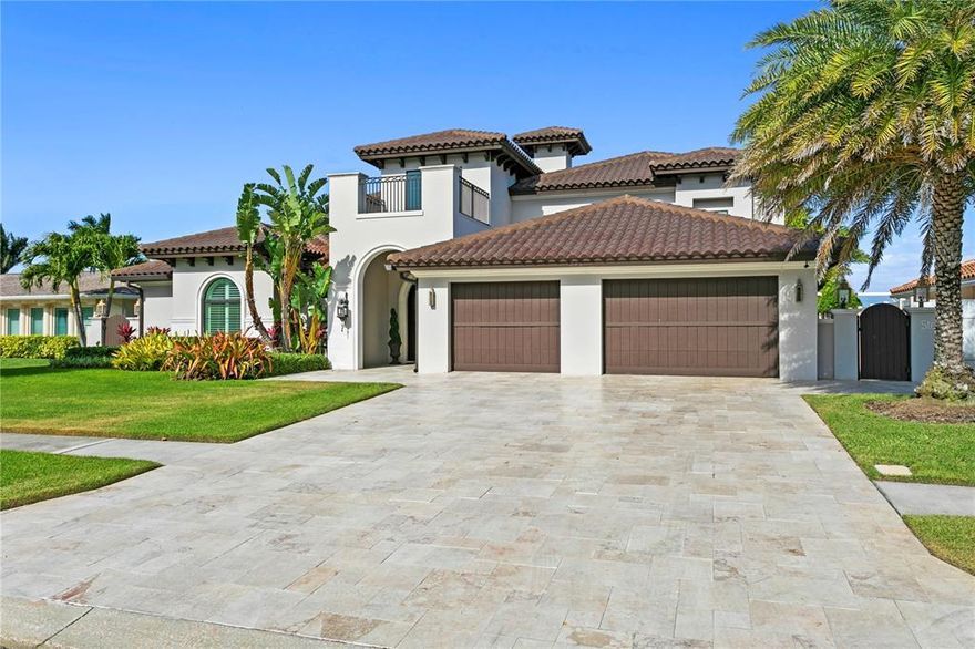 Custom Remodel Open Waterfront Home in ISLAND ESTATES!!  Most desirable street with underground utilities!  Deep Water Boat Slip with 16,000lb Lift with easy Gulf Access.  Designed with every luxury and quality in mind focusing on the outdoor space as your waterfront resort!  From your front entrance you are captured by the beauty of the waterfront.  The foyer stuns with a hand-crafted chandelier, custom wood/traverine inlay and quality designed millwork.  First-floor master suite offers a luxurious bath with rain shower, cathedral ceiling, Venetian plaster and marble flooring.  Your chef-style kitchen has a large marble topped island, Gas Stove top cooking, custom cabinetry.  Temperature controlled wine cellar for up to 800 bottles.  3 guest bedrooms and Office with murphy bed (could be 5th bedroom) upstairs.  The office and 2 of the guest bedrooms have balcony with amazing water views.  Your outdoor space flows with a lavish pool area with LED lighting, surround sound, waterfall and firepots, Gazeboo and beautiful, tropical landscaping.  This is a waterfront paradise!   All room measurements are approximate and must be verified by buyer.