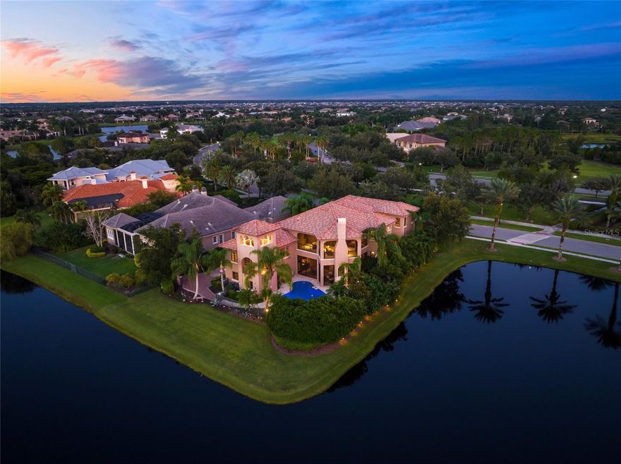 Experience luxury living in this fully furnished 5,726 sq. ft. Mediterranean estate, set on a premier lot in the admired Lake Club community. Built in 2008 and upgraded in 2020 and 2023, this home seamlessly blends timeless elegance with modern comfort.

A grand gated driveway winds through lush landscaping, offering both privacy and a memorable arrival. Inside, 12-foot ceilings, a distinctive bell tower with panoramic views, and French doors open to private courtyards and balconies, filling the home with natural light and creating a seamless indoor-outdoor flow.

The second floor features a primary suite with a boutique-style walk-in closet, a private screened balcony with a fireplace, and a spa-like en suite with dual rain showers. Two additional bedrooms are also upstairs, while a guest suite is conveniently located on the main floor.

Designed for both relaxation and entertaining, the estate includes a gourmet kitchen, spacious living and family rooms with two fireplaces, an entertainment media room with a wet bar and full bath, and a versatile fitness or yoga room. Outdoors, enjoy a newly renovated pool and pool deck, surrounded by artificial turf for low-maintenance greenery. A newly updated 3-car garage completes this property’s refined appeal. Nearby conveniences include Starbucks (1.8 miles), Publix (1.5 miles), and Ruth’s Chris Steakhouse (2.7 miles), ensuring effortless luxury living. This rare opportunity offers a lifestyle of unparalleled luxury and tranquility, and is being sold fully furnished.