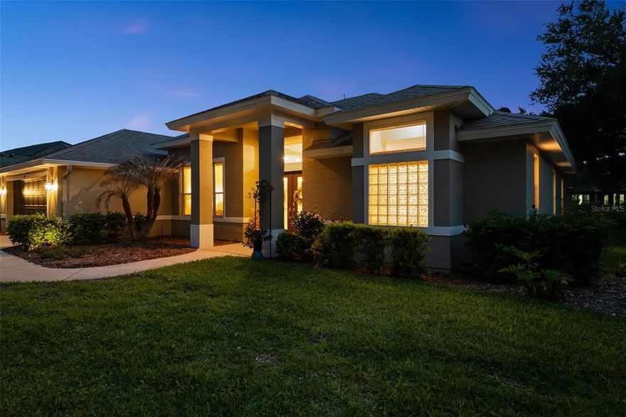 Elegance and functionality exude in this beautifully-maintained ICI Chatham model.  Enter through grand double doors into a light-filled home with neutral tones, custom niches, and a decorative knee wall. The living room features a stunning lighted two-tone coffered ceiling, creating a warm and inviting centerpiece. This split floor plan includes 3 bedrooms and 2 bathrooms, with one bath providing direct outdoor access-perfect for a future pool. Enjoy high ceilings, abundant storage, a formal dining room, and an eat-in kitchen with breakfast bar. The indoor laundry room includes upper cabinets and a utility sink. Relax on the screened lanai overlooking a landscaped, pool-ready backyard with fountain and sunset views. Located in a 24-hour manned gated community, with the home having its own security system included for peace of mind. Community features two 24/7 manned gate entrances, pool, clubhouse, tennis courts and pickleball, playground, and an all sports field. The location is ideal with quick access to I-95, restaurants, Advent Hospital, Halifax Hospital Emergency Room, medical offices, shopping, and more.  Roof is 2022, water heater is 2021, AC is 2014.