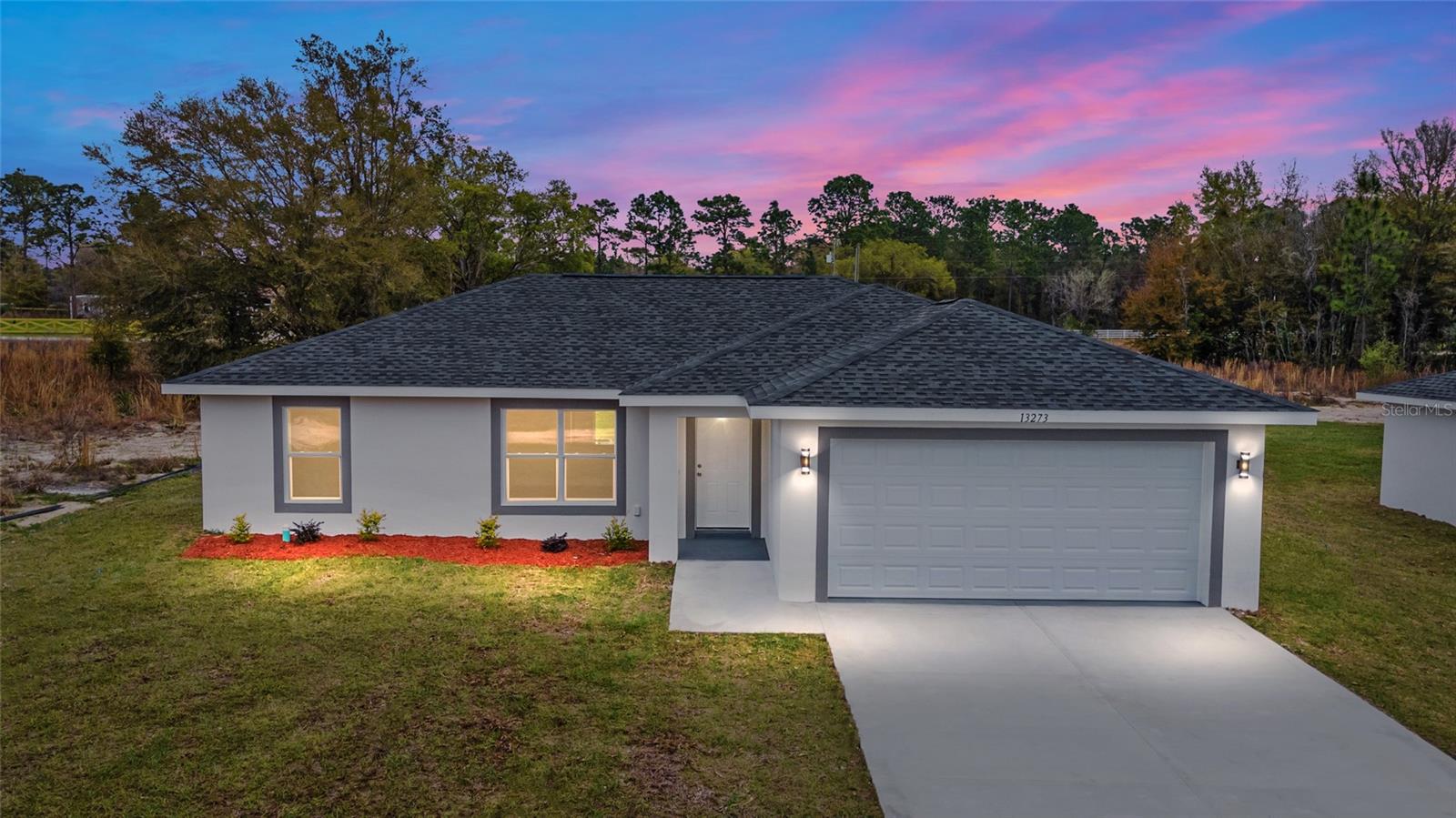 Under Construction. Welcome to this stunning new construction "Magnolia" model by Bakan Homes nestled between Hwy 484 in Marion Oaks and Marion Oaks Manor. Offering 1,267 square feet of living space and a total footprint of 1,743 square feet, this thoughtfully designed residence sits on a nearly .50-acre lot, providing plenty of outdoor potential and privacy. With 8’ ceilings in the bedrooms and vaulted ceilings in the social areas, this home welcomes you with a sense of openness and comfort. The heart of this home boasts soft-close cabinets, elegant quartz countertops, and top-of-the-line stainless steel appliances, including a dishwasher. It's a chef's dream! The kitchen peninsula is adorned with seeded LED pendant lighting, adding a touch of sophistication to your space. Luxury water-resistant vinyl plank flooring throughout the home not only looks beautiful but also ensures easy maintenance, making it perfect for families and pet owners. This home offers the perfect blend of functionality and aesthetics, ensuring you can enjoy modern living without breaking the bank. Your investment is protected by a limited Builder Warranty that expires 1 year after the issuance of the Certificate of Occupancy. Pictures are of a recently completed model. Colors, finishes, and appliances may vary from home to home. Estimated completion dates are only an estimate and can be delayed due to unforeseen circumstances.