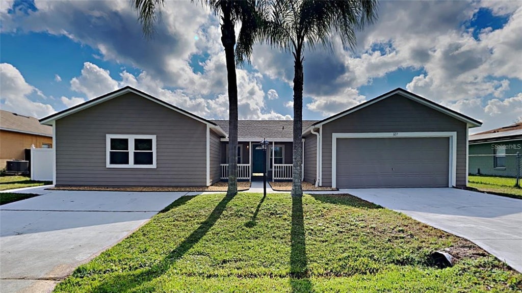Photo of 327 Marquee Drive, Kissimmee, FL 34758 (MLS # O6451220)