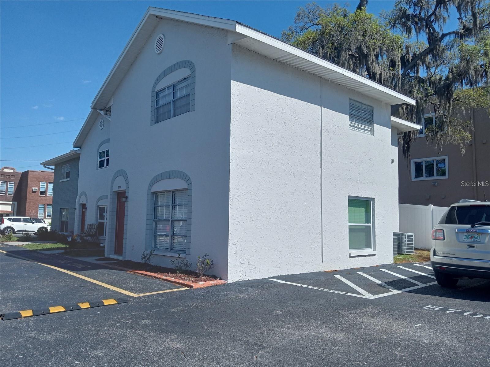 Townhome-style condo located in the heart of vibrant Downtown New Port Richey. Positioned just steps from the scenic Cotee River and only 3 miles from the Gulf of Mexico, this unit offers unbeatable access to the area’s waterfront parks, beaches, and cultural attractions. Enjoy a stroll through downtown’s walkable streets, filled with restaurants and cafes. A sparkling community pool is located directly across from your unit, and assigned parking is available for added convenience. Inside, the home features: A fully equipped kitchen with newer appliances, an open-concept living/dining area, an In-unit washer/dryer combo (rare in this complex) Two spacious bedrooms and a full bath upstairs. A convenient guest half-bath on the main level, ample storage, including a pull-down attic for seasonal items. Available now.