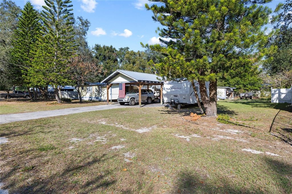 Photo of 2910 E 147th Avenue, Lutz, FL 33559 (MLS # TB8460696)
