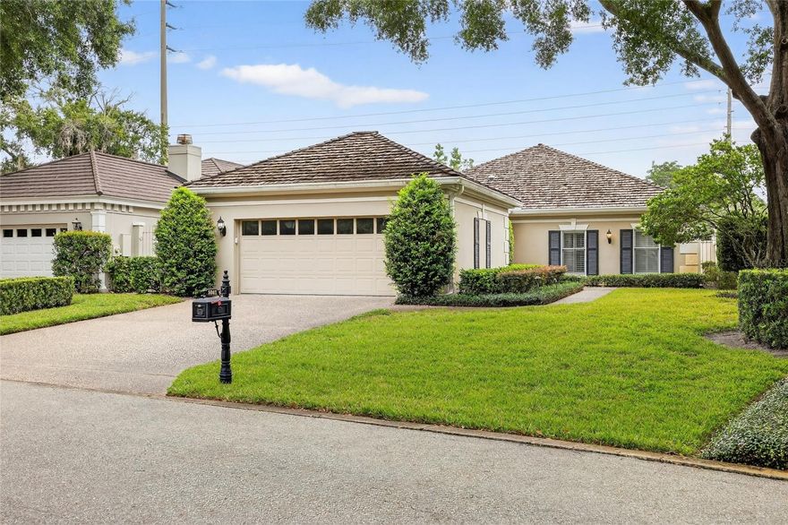 Welcome to this desirable gated community of Bay Hill Village! Upon driving up to this wonderful property you will be greeted by the elegance of your future residence within the exclusive gates of Bay Hill Village—one of the most sought-after communities in the Dr. Phillips area, renowned for its prestigious golf course, making it a perfect haven for golf lovers! Step through the charming, covered porch, where you’ll find newly laid luxury vinyl flooring that flows seamlessly throughout the hallway, kitchen, lounge, and sunroom. The kitchen boasts natural light and features all-white appliances, including a double oven, microwave, and fridge/freezer. The cozy breakfast area is perfect for informal gatherings, while the free-flowing open floor plan connects the kitchen to the dining area—ideal for entertaining or larger family gatherings. The living area has a unique fireplace, which sets the scene perfectly for the Holidays.  The master suite offers a generous closet and a newly renovated en-suite bathroom, complete with dual sinks and a gorgeous walk-in shower. The second and third bedrooms are also of ample size, featuring luxurious fitted carpets that add warmth and comfort. This community truly has it all! Enjoy access to a wonderful swimming pool, tennis courts, and an exceptional clubhouse and gym. There is nothing you won’t love about these facilities. The walled-in back garden allows privacy and serves as a cute oasis adorned with shrubs and plants where you can enjoy your morning coffee or sipping on an evening cocktail in this little gem of tranquility. This is a once-in-a-lifetime opportunity to own a piece of paradise in the prestigious gated Bay Hill Village community. Schedule your showing today and experience the incredible lifestyle that awaits you!