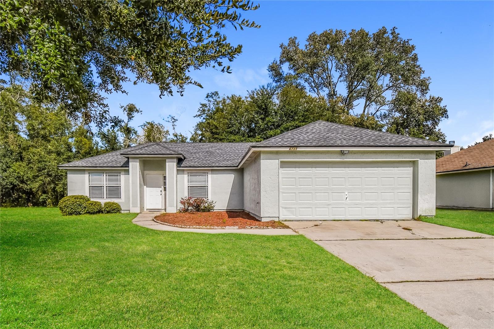 Home was freshly painted! Majority of the windows were replaced as well. Comes with all kitchen appliances. Welcome to your next home at 6735 Salt Pond Dr N in Jacksonville! This inviting 3-bedroom, 2-bathroom property offers a perfect blend of comfort and convenience. You'll enjoy a spacious open floor plan ideal for both relaxing and entertaining. Step outside to a large backyard—perfect for weekend gatherings, family fun, or letting pets roam freely. A neighborhood playground and basketball court are just around the corner, making it an ideal location for active families. The home also includes a two-car garage for ample parking or storage. Don’t miss out—schedule your tour today and make this beautiful home yours!
