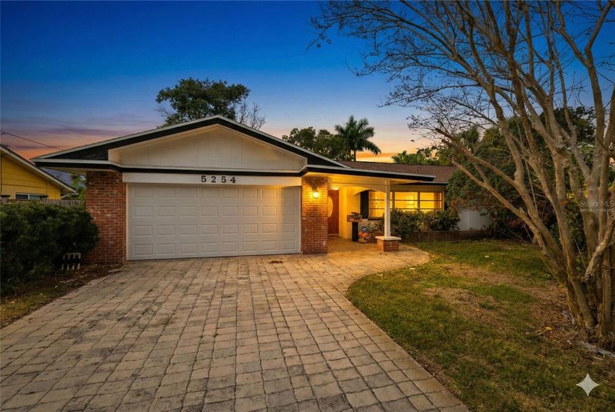 One or more photo(s) has been virtually staged. Traditional mid-century Florida ranch in Shore Acres, just 2–3 miles from downtown St. Petersburg. This 4-bedroom, 3-bath pool home offers 1,861 square feet of living space on a nearly 10,000-square-foot lot, with a screened lanai, a fenced yard, and a two-car garage with additional storage. The neighborhood is established and walkable, with sidewalks, street lighting, and mature landscaping.

Inside, the layout is open, comfortable, and designed for Florida living. The living room is spacious and welcoming. The family room and dining room open through pocket sliding glass doors to the screened lanai, creating an indoor–outdoor flow that works year-round. Morning coffee by the pool. Evenings that extend naturally into the lanai. The pool is just steps away, and the spaces connect without feeling crowded.

The kitchen has been thoughtfully updated with quartz countertops, soft-close wood cabinetry, a breakfast bar, and a pass-through window to the covered screened patio. Whether entertaining or keeping things casual, the layout supports both.

The split floor plan offers privacy where it matters. Bedrooms two and three share a Jack-and-Jill bath. A separate pool bath with a walk-in shower makes hosting easy. The primary suite includes a walk-in closet and an updated bath with neutral quartz counters and wood cabinetry. Tile flooring runs throughout the home for easy maintenance.

High baseboards, new interior doors, neutral paint, and abundant natural light give the home a clean, move-in-ready feel. Major updates and remodels were completed with permits, including an elevated air conditioning system and a new water heater. The home has passed a four-point inspection, offering added peace of mind.

Outdoors, the large landscaped yard offers space and privacy that are increasingly hard to find at this price point. The upgraded paver driveway accommodates approximately six vehicles and leads to the two-car garage. A covered front porch with dual leaded glass doors welcomes you inside. Out back, the screened lanai includes a generous covered patio, keeping the pool and entertaining area usable rain or shine. The fenced yard is private, pet-friendly, and ready for gatherings. No HOA. No CDD.

Location is a key highlight. Shore Acres Elementary School is within walking distance. Water access is just minutes away at Coffee Pot Park, Flora Wylie Park, and Elva Rouse Park, offering boat ramps, kayak launches, and scenic waterfront paths without the premium pricing of direct waterfront property.

Downtown St. Petersburg is an easy 2–3 miles by bike or car, with access to world-class museums, dining, and waterfront destinations including the Salvador Dalí Museum, the St. Pete Pier, and Beach Drive’s vibrant promenade. World-famous Gulf beaches are approximately a 20-minute drive.

This Shore Acres home offers a true Florida pool lifestyle with water nearby, downtown close, solid construction, thoughtful updates, and an easy, livable feel.