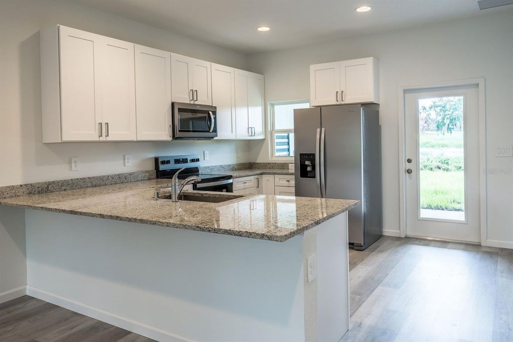 Photo of 5365 Vista Lago Dr, Orlando, FL 32811 (MLS # O6453382)