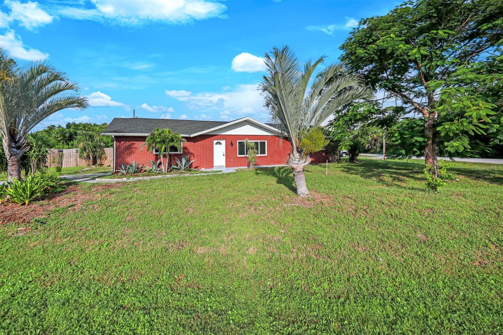 Bright & Beautiful 3 Bedroom, 2 Bath Home on a Corner Lot in the Heart of Port Charlotte! From the moment you walk in, this open floor plan welcomes you with an abundance of natural light in every room. Perfectly positioned on a spacious corner lot in a friendly, established neighborhood, this home is bursting with charm and upgrades. Enjoy peace of mind with a BRAND NEW 2025 A/C system and a NEWER ROOF! The kitchen shines with crisp white cabinetry, stainless steel appliances—including a Smart refrigerator—and opens into the dining area, making it perfect for family gatherings. Tile floors flow throughout the home for a clean, cohesive look. Step into the enclosed, air-conditioned Florida sunroom overlooking your fully fenced backyard—perfect for pets, entertaining, or simply soaking in those breathtaking Florida sunsets. Centrally located, you’re just minutes from shopping, dining, and everything Port Charlotte has to offer. Don’t wait—schedule your showing before this beauty is gone!