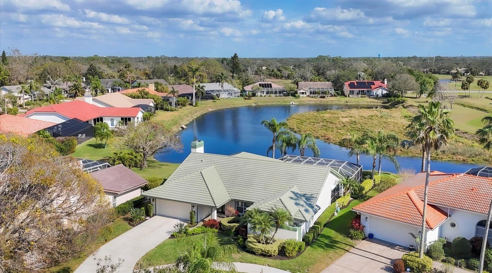 Exquisite lakefront living, a move-in ready masterpiece! Luxury and tranquility await in this spotless, hurricane-ready, turnkey-furnished pool home in the Highlands section of The Meadows, a park-like oasis 15 minutes from downtown. Meandering canopied streets, a quiet cul-de-sac and tropical landscaping welcome you home. Inside you will be greeted by an open and airy ambiance enhanced by gleaming hardwood floors, high ceilings and a chef’s dream kitchen with granite countertops, solid wood soft-close cabinetry, premium stainless appliances and a breakfast bar for gathering. Designed for seamless indoor-outdoor living, the spacious covered lanai is an idyllic retreat for relaxation and entertaining. Here, you’ll be captivated by breathtaking lake views, a mesmerizing parade of birds and awe-inspiring sunrises each morning. Just tunning. All turnkey furnished, with ideal southeastern exposure, and just a short ride to all the fun The Meadows has to offer. A five-star location on 1,600 park-like acres, The Meadows is a resort lifestyle community 15 minutes from downtown. Residents enjoy 14 miles of biking and recreational trails, fun-filled activities, a fitness center, a Junior Olympic pool, pickleball courts, dining venues, pay-to-play three 18-hole golf courses and a top-notch tennis complex. Its prime location places you near award-winning beaches, remarkable arts and culture, Nathan Benderson Park, the upcoming Mote SEA Aquarium, Sarasota Orchestra, Whole Foods, Trader Joe’s and The Mall at University Town Center, a world-class shopping, entertainment and dining destination. A fabulous Florida lifestyle awaits. A 2024 electric panel, 2014 air-conditioning system, 2011 tile roof, re-piped, impact windows and motorized storm shutters, irrigation well, above flood plain in zone X.