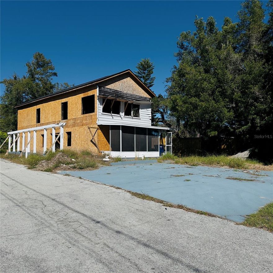 FIXER UPPER with a lake view! Needs full rehab except for roof!