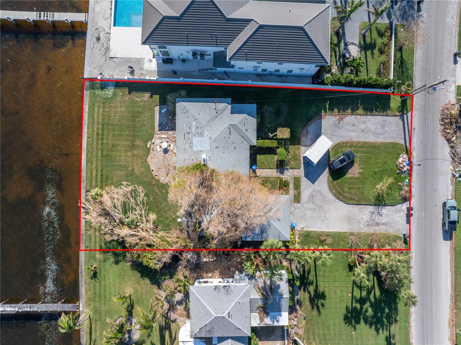 LOCATION LOCATION LOCATION!! Being sold for lot value. Located in Snell Isle on one of the most exclusive streets, Brightwaters Blvd. This single story ranch home flooded during Hurricane Helene. Large lot to build your dream home, lot size is 100 X 185. This prime location offers open water views and direct access to Tampa Bay and the Gulf of Mexico, with no bridges height, allowing for easy navigation of larger boats. Seawall is maybe 10 years old in great condition and has a wide cap. Views of downtown St Pete can be seen on the dock to be able to watch the fireworks. Conveniently located near downtown St. Petersburg, the St. Pete Pier, The Vinoy Renaissance Hotel and Golf Club, Tampa International Airport, shopping, fine dining and more.