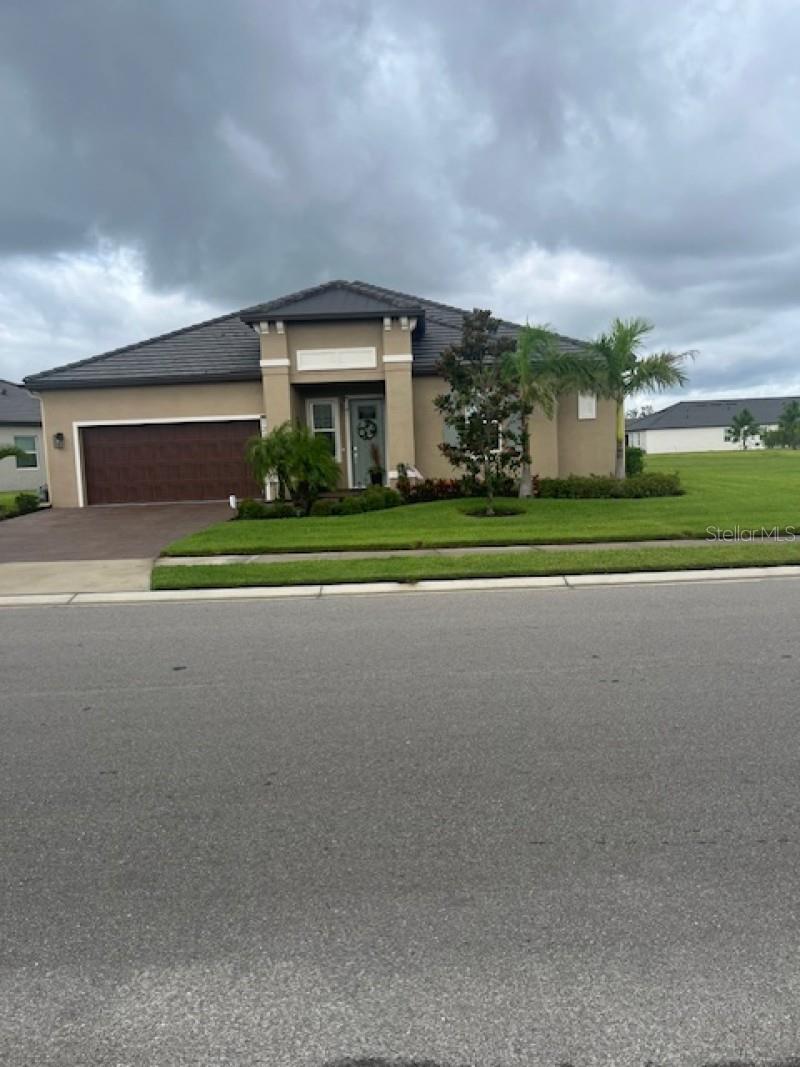 This 2218 sf home on a premium lot is move in ready and has all the custom upgrades that truly sets it apart. Welcome to this executive home in Prosperity Lakes Parrish. This home boasts contemporary living in this beautiful active adult community where the fun never ends. Built in 2023, this home offers 2-bedroom, 2.5-bath with flex room to make this open floor plan overlooking the nature conservation a place to relax and enjoy. The kitchen is both stylish and functional, featuring Quartz countertops, a spacious island with pendant lighting, an oversized custom walk-in pantry, full designer backsplash throughout. The family room has a custom gas fireplace with floating shelves creating a beautiful entertainment center. Ceramic tile throughout home with bamboo flooring in bedrooms. Also crown molding and bullnose drywall corners throughout home. The outdoor space is ideal for entertaining day or night with screened lanai finished with paver flooring and overlooking conservation area. Additional thoughtful touches include a 2-car garage with walk-up attic storage no ladders needed and an extended driveway. Living in Medley means access to unmatched amenities, including a private clubhouse with a resort-style heated pool, poolside bar and café, ballroom, card and billiard rooms, fitness center, pickleball, tennis, bocce courts, dog park, and more. The community is golf cart friendly, with high-speed internet, lawn care, and exterior painting all included in the HOA fees.