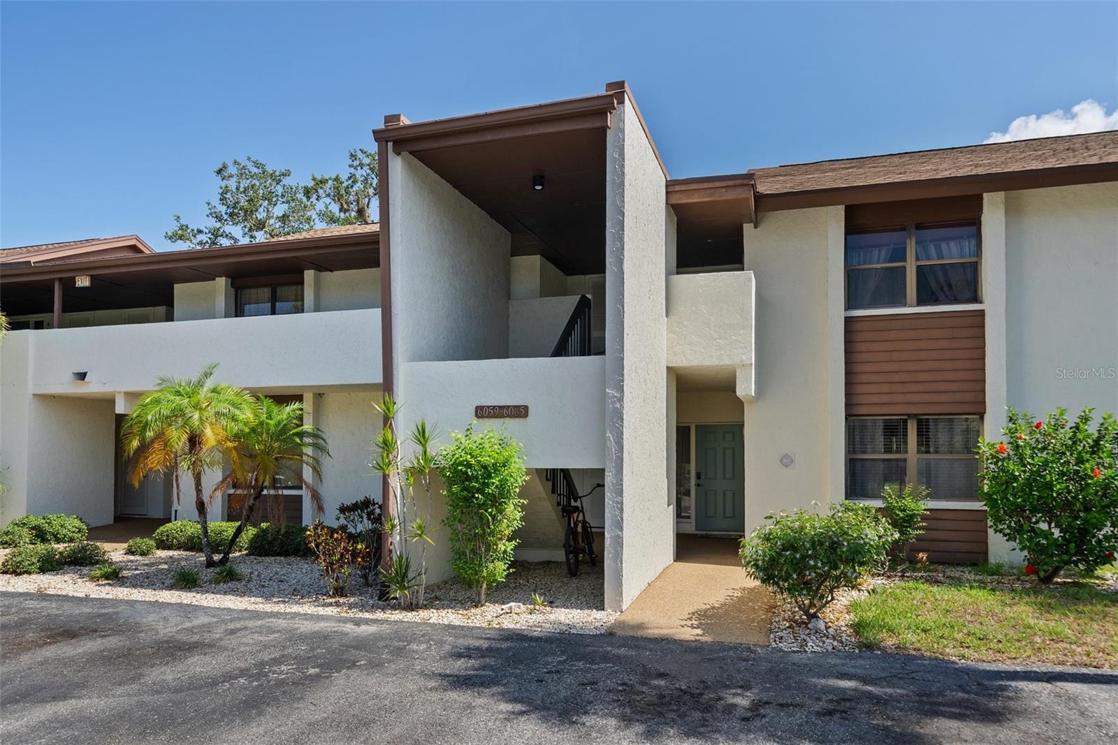One or more photo(s) has been virtually staged. Welcome to this rare first-floor, end-unit 2-bedroom, 2-bath condo located on Hole #1 of the picturesque 9-hole golf course in Timber Creek, a highly desirable 55+ community in Bradenton, Florida—just under 5 miles from the stunning beaches of Anna Maria Island. Inside, you’ll find an updated kitchen and new vinyl flooring, offering a fresh, modern feel with low-maintenance comfort. This well-positioned condo offers both privacy and convenience, with resort-style amenities including tennis and pickleball courts, a heated pool, hot tub, sauna, shuffleboard, and a clubhouse filled with social activities year-round. Enjoy maintenance-free living just minutes from shopping, dining, and entertainment, with easy access to Siesta Key, Longboat Key, Downtown Sarasota, St. Armands Circle, the Van Wezel Performing Arts Hall, and the Ringling Museum. You’ll also appreciate the close proximity to Bradenton-Sarasota and Tampa International Airports. Whether you're seeking a seasonal escape or full-time Florida lifestyle, this move-in ready condo delivers the perfect mix of golf, relaxation, and Gulf Coast living—schedule your showing today!