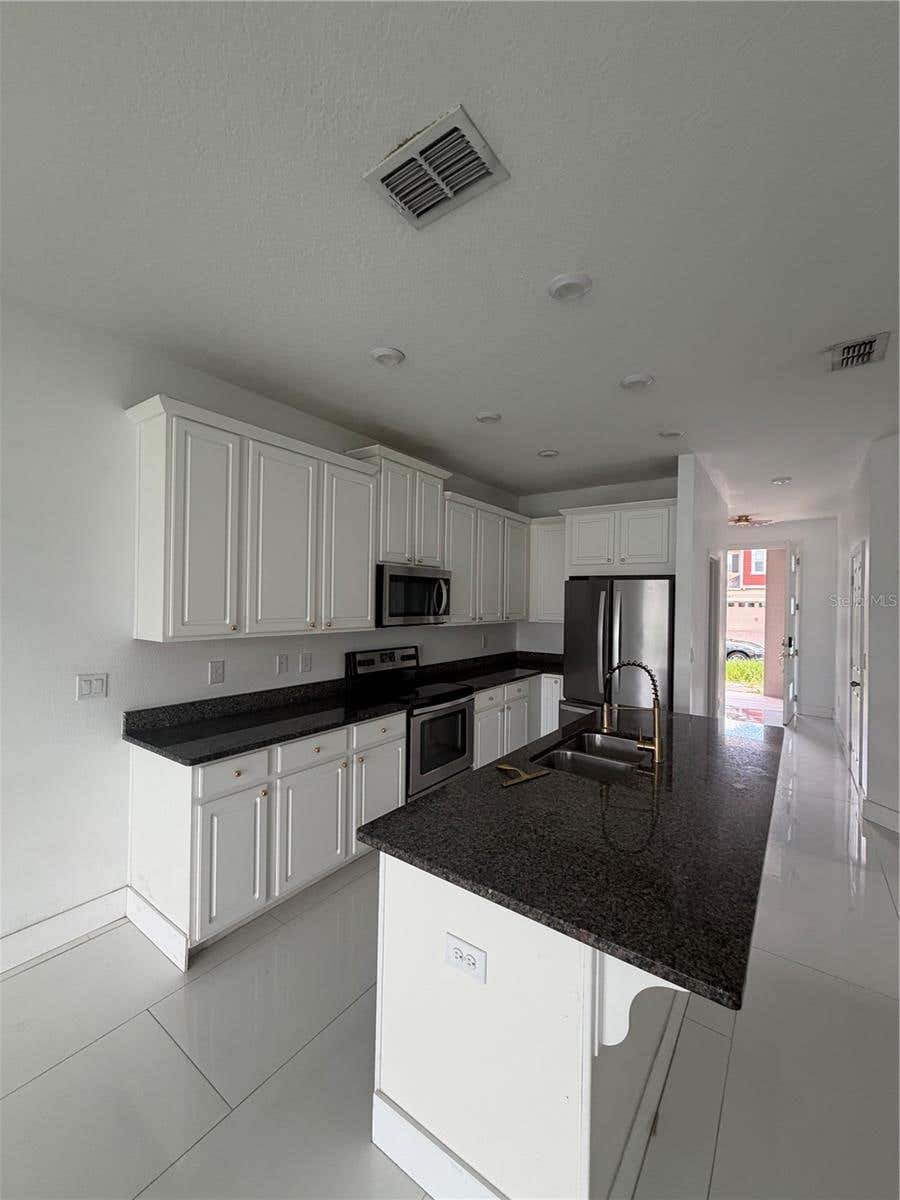 Photo of 2551 Avian Loop, Kissimmee, FL 34741 (MLS # O6435039)