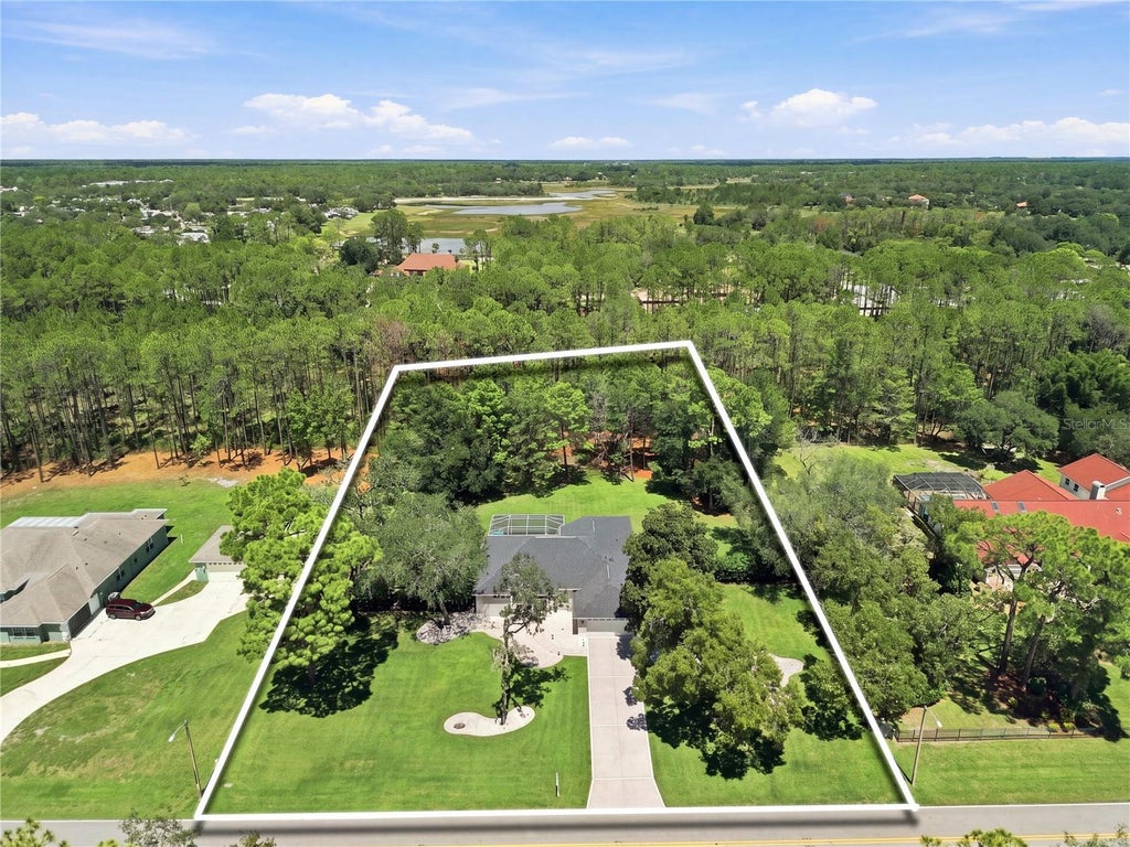 Photo of 10261 Woodland Waters Boulevard, Weeki Wachee, FL 34613 (MLS # W7889067)