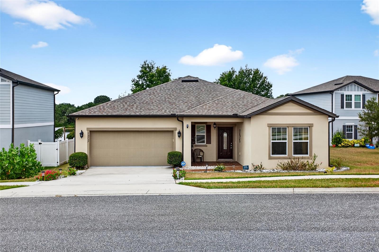 Don’t miss this great opportunity to own a 3 bedroom, 2 bath solar powered home (will be paid off at closing by seller) in the gated community of Shearwater Estates. From the moment you arrive, you’ll notice the impressive tiled entryway. Inside, the home features new vinyl plank flooring throughout the main living areas. The kitchen includes granite countertops, a center island, stainless steel appliances, a corner pantry, and plenty of cabinet and counter space. It opens up to the spacious family room, which has sliding glass doors leading to the covered rear lanai, perfect for relaxing or entertaining. The primary suite offers a walk-in closet, extended vanity, and a glass enclosed shower. The two additional bedrooms share a full hall bathroom. Enjoy peaceful views of Gallows Lake right from your backyard. Shearwater Estates is a gated community offering added security and privacy. Conveniently located in the heart of Mascotte, you’re close to shopping, dining, and major roadways yet tucked away in a quiet, scenic setting.