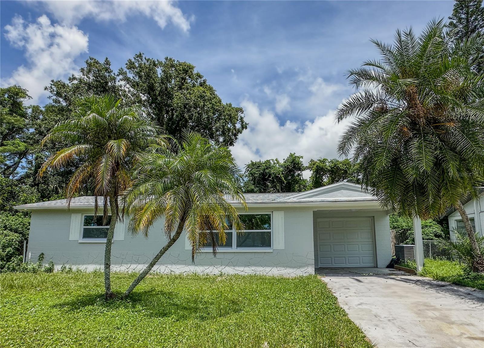 2025 Rebirth Property with Florida Classic Architecture: An upgraded modern gem home with exceptional renovations, featuring 2 bedrooms, 1 bathroom, and a flex sunroom. With a total of 1,363 sq. ft. (990 sq. ft. heated). From the roof to the floors, from the kitchen to the bathrooms, every inch of the space, has been renovated to reflect today's modern trends. 2025 TRANSFORMATION HIGHLIGHTS with the full home renovation including but not limited to:
- New roof installation. - Luxury Vinyl Planks flooring throughout, durable, and enhancing the home’s stylish atmosphere. - Fresh interior/exterior paint. - Chef-ready Kitchen: The White Shaker cabinets make a kitchen feel brighter and more open, with granite countertops, paired with a full suite of LG stainless steel smart appliances. - Bathroom: May 2023 renovation offers an immersive bathroom experience, featuring porcelain floor tile, a new tub, tiled shower and new vanity.
**Mechanical Updates**: - HVAC system replaced October 2019 **SMART LIVING SPACES** • 2 Generous Bedrooms + Multi-Use bonus room/office/den/bedroom/sunroom (12.5 x 10.5) • Private Front Porch + Low-Maintenance Backyard Beacon Square is a charming neighborhood located in New Port Richey, Pasco County, Florida. Known for its family-friendly environment, it offers a variety of amenities, including parks, schools, and recreational facilities. With a mix of single-family homes and townhouses, Beacon Square is an ideal place for those seeking a peaceful yet vibrant suburban lifestyle. The community is well-connected with easy access to major highways, making it convenient for commuting. To Tampa Downtown: The drive is approximately 38 miles and takes about 50 minutes via FL-54 and FL-589 S. There are alternative routes that can reduce the travel time slightly. To Tampa International Airport (TPA): The distance is around 35 miles, and the drive takes about 40 minutes via FL-54 and FL-589 S. The property is a rare and valuable investment and residential opportunity. Call now, our top-tier agent is available 24/7 to assist you to schedule your tour and witness the changes of this reborn home!
