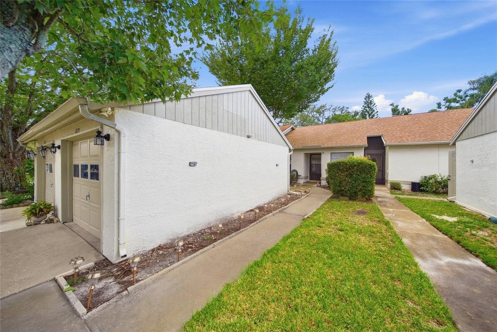 Photo of 11715 Spring Tree Lane, Port Richey, FL 34668 (MLS # TB8549576)
